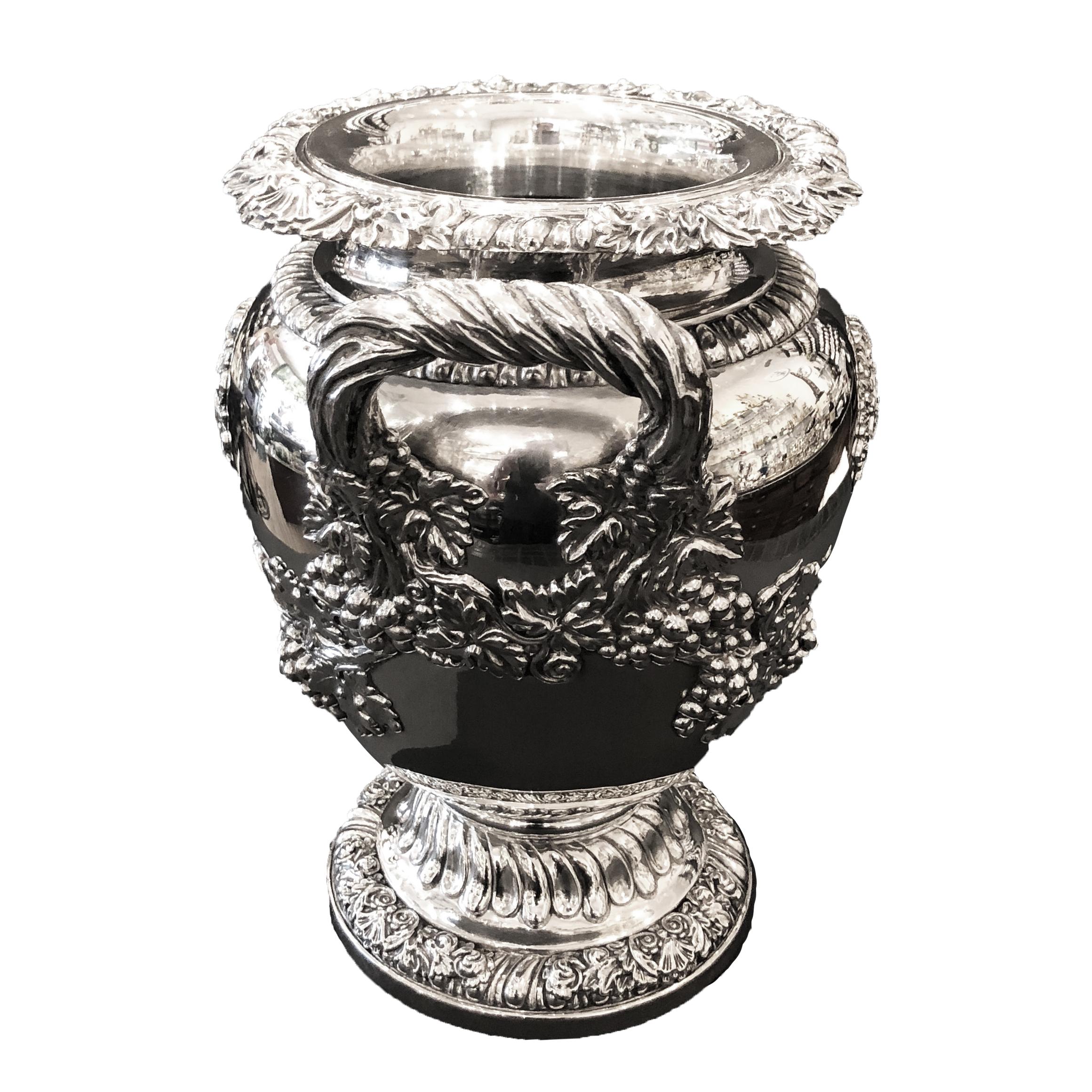 These very elegant wine coolers and liners are from Odiot favorite silversmith of emperor Napoleon the 1st 
The body of the bucket on his pedestal foot is silver plated, but all garnishing like the garlands of grapes climbing towards the handles