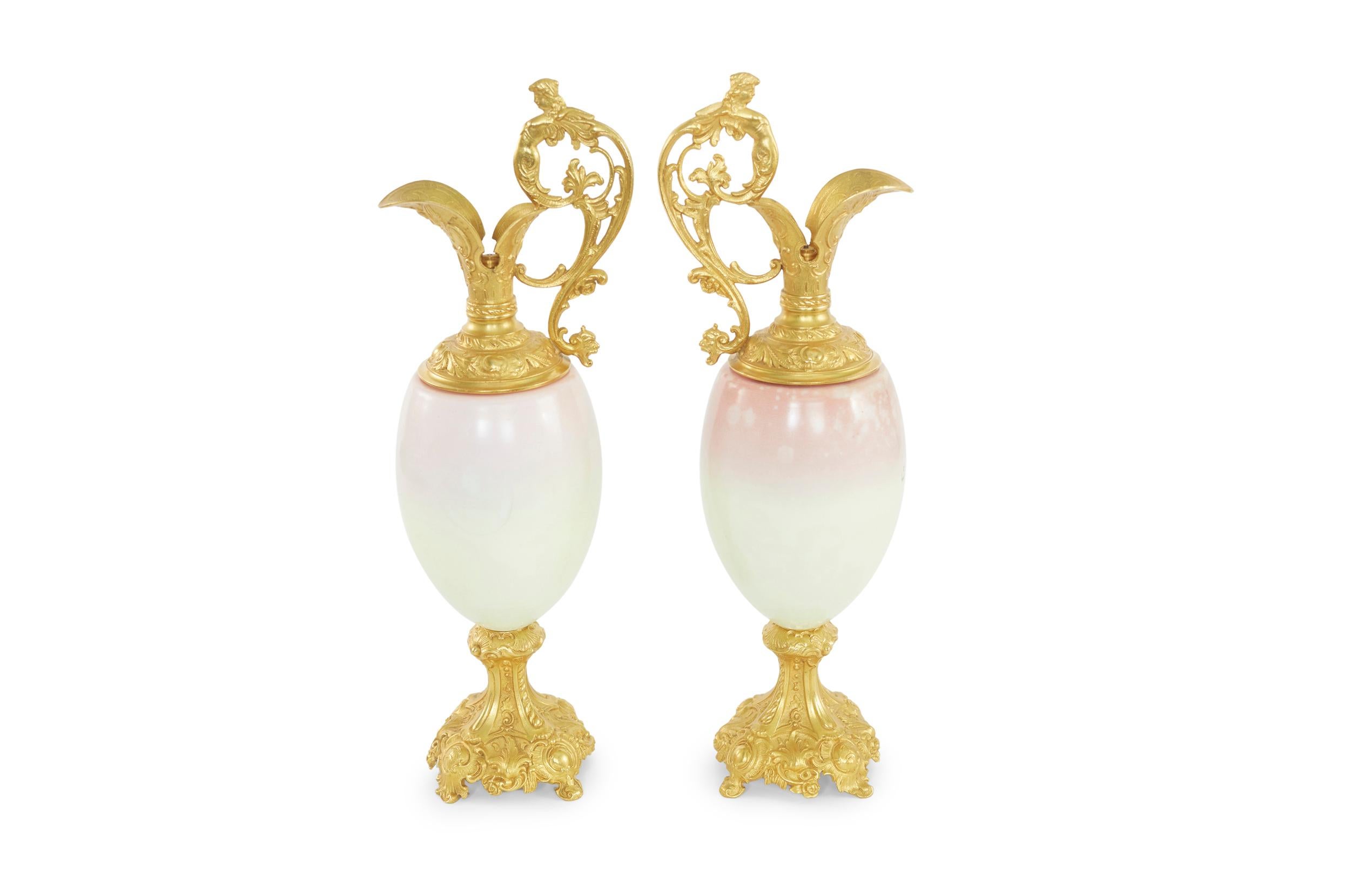Late 19th century pair of ormolu mounted two handled sevres style decorative vase . Each one featuring an ovoid baluster shape with handle formed of maidens with a foliate scroll motif. Each vase / piece is in good condition, minor wear appropriate
