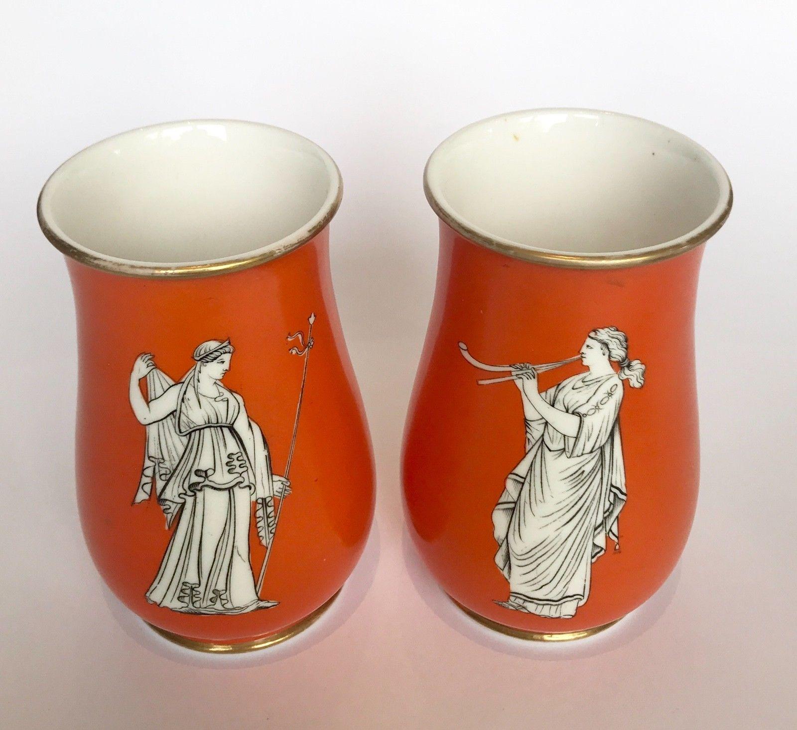19th century pair of Samuel Alcock neoclassical porcelain vases, circa 1860 decorated with Grecian maidens playing musical instruments all against an orange ground.