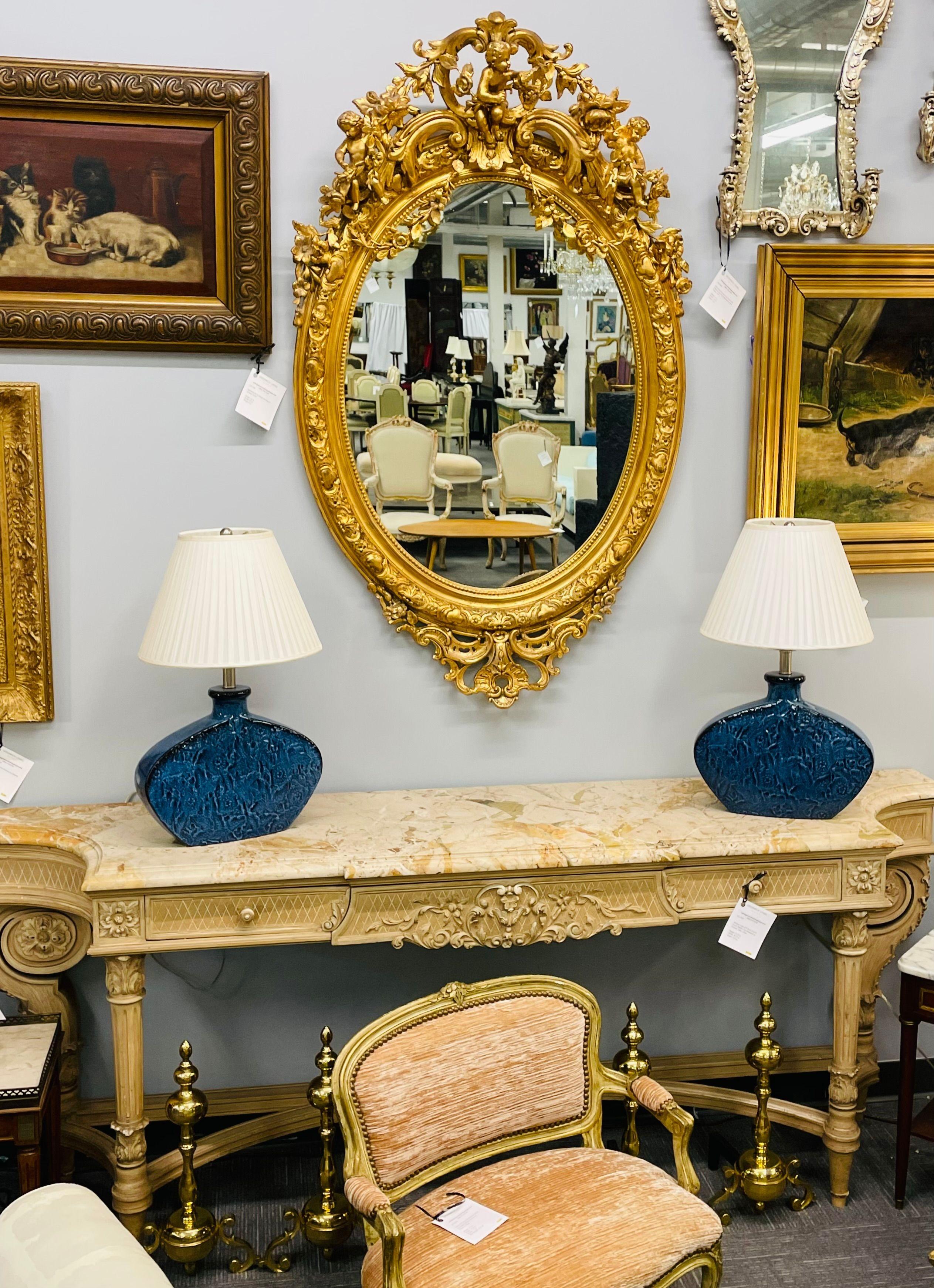 19th Century Palatial Giltwood Wall or Console Mirror Adorning Three Cherubs In Good Condition For Sale In Stamford, CT