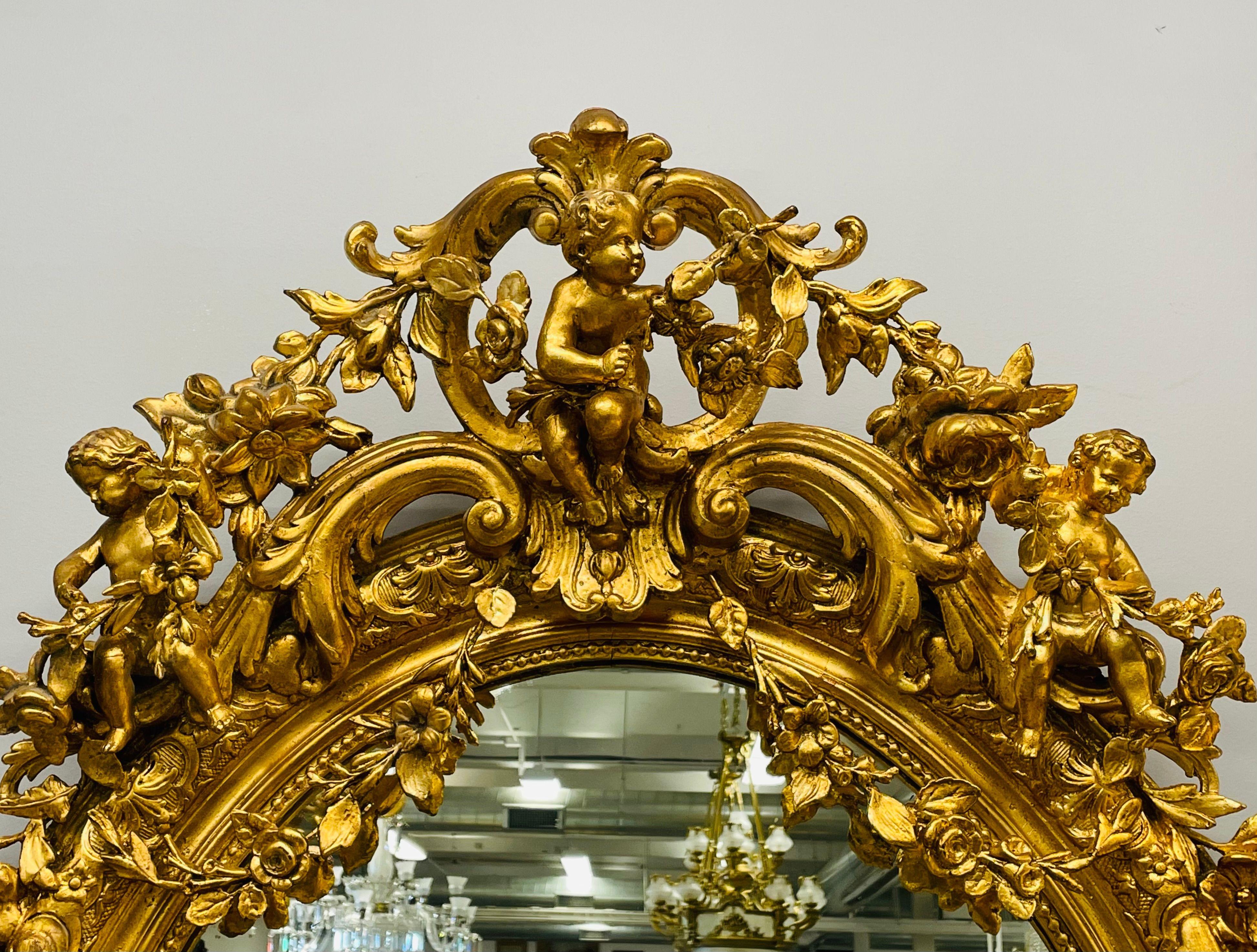 19th Century Palatial Giltwood Wall or Console Mirror Adorning Three Cherubs For Sale 1