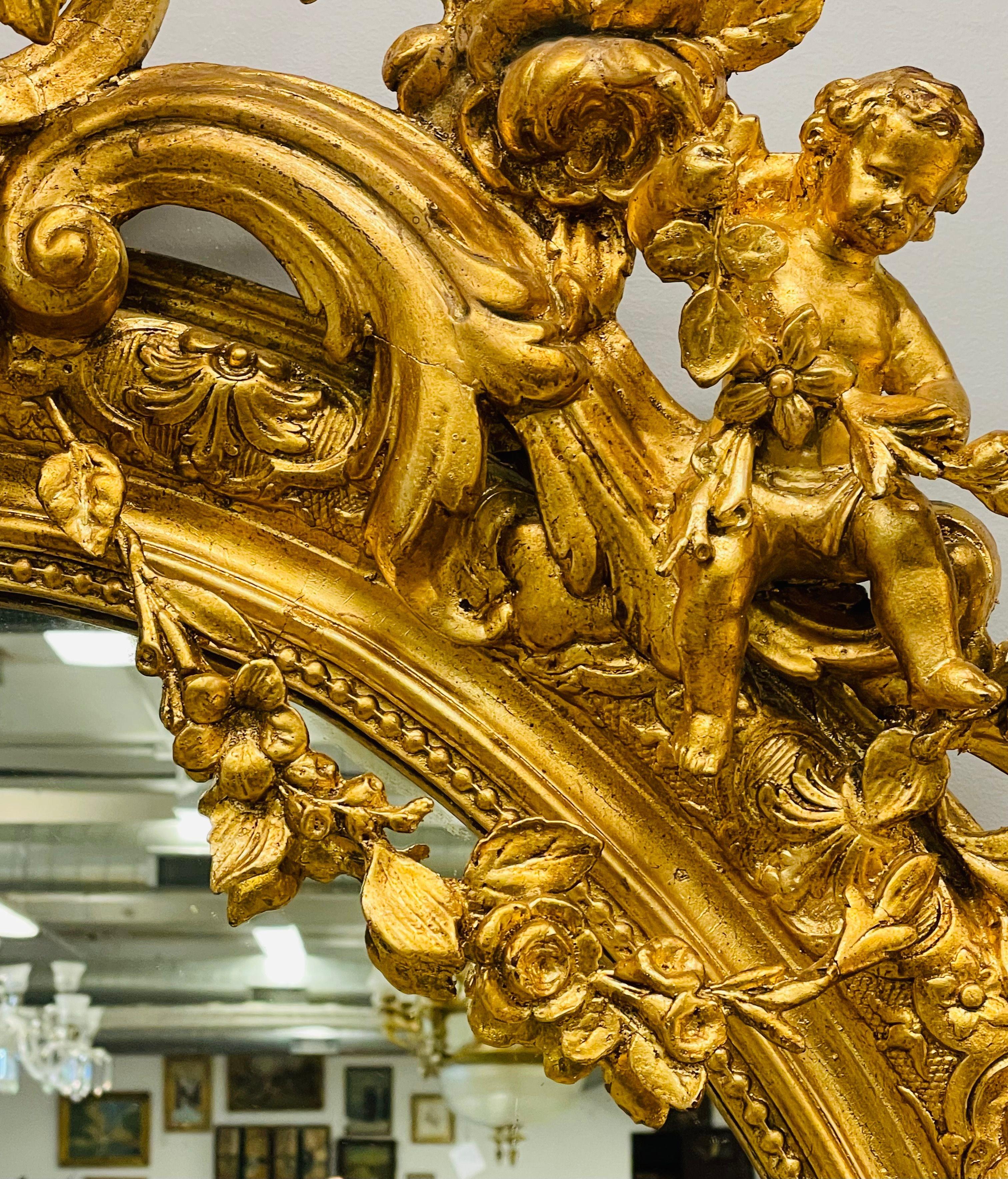 19th Century Palatial Giltwood Wall or Console Mirror Adorning Three Cherubs For Sale 3