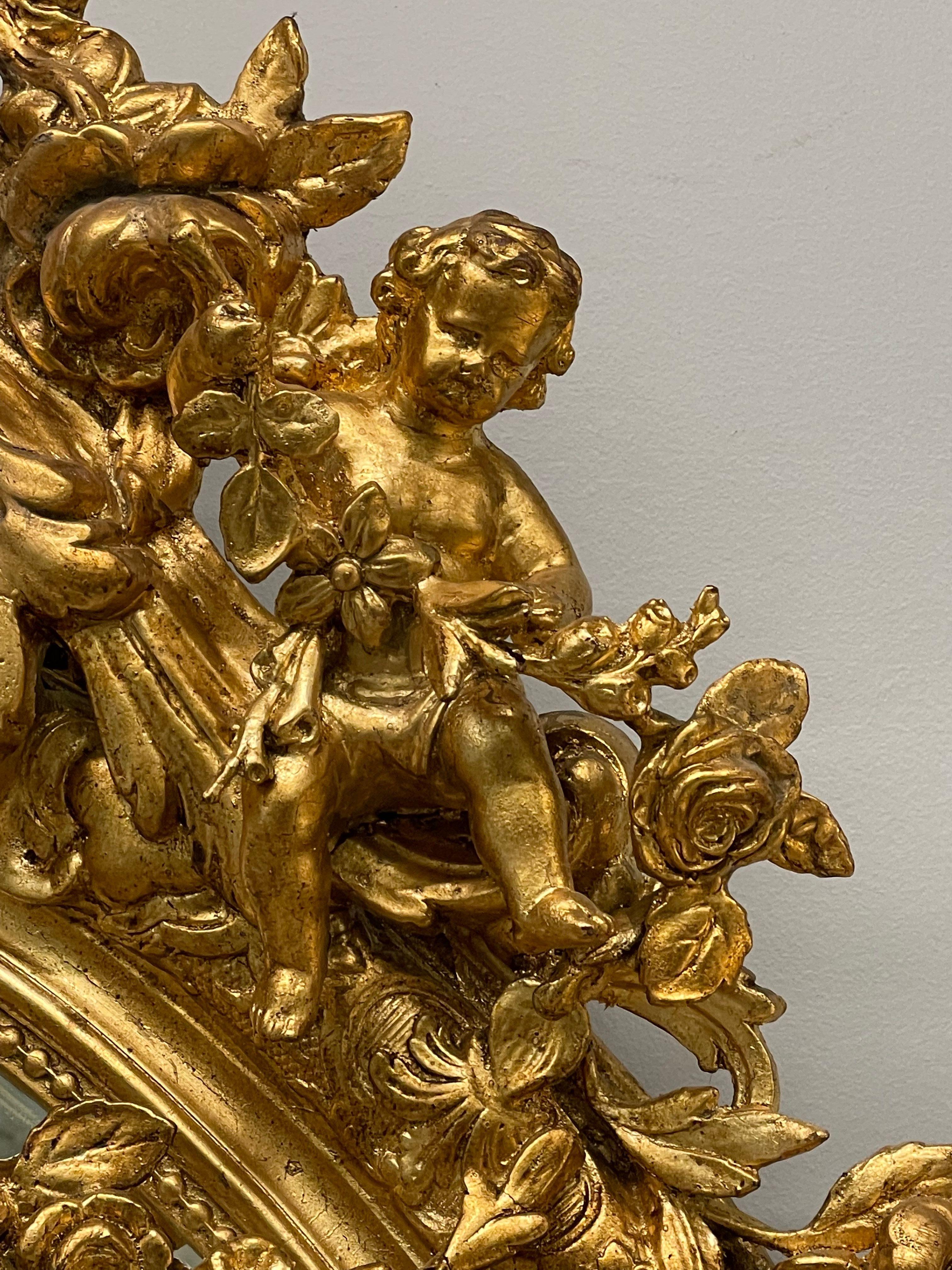 19th Century Palatial Giltwood Wall or Console Mirror Adorning Three Cherubs For Sale 4