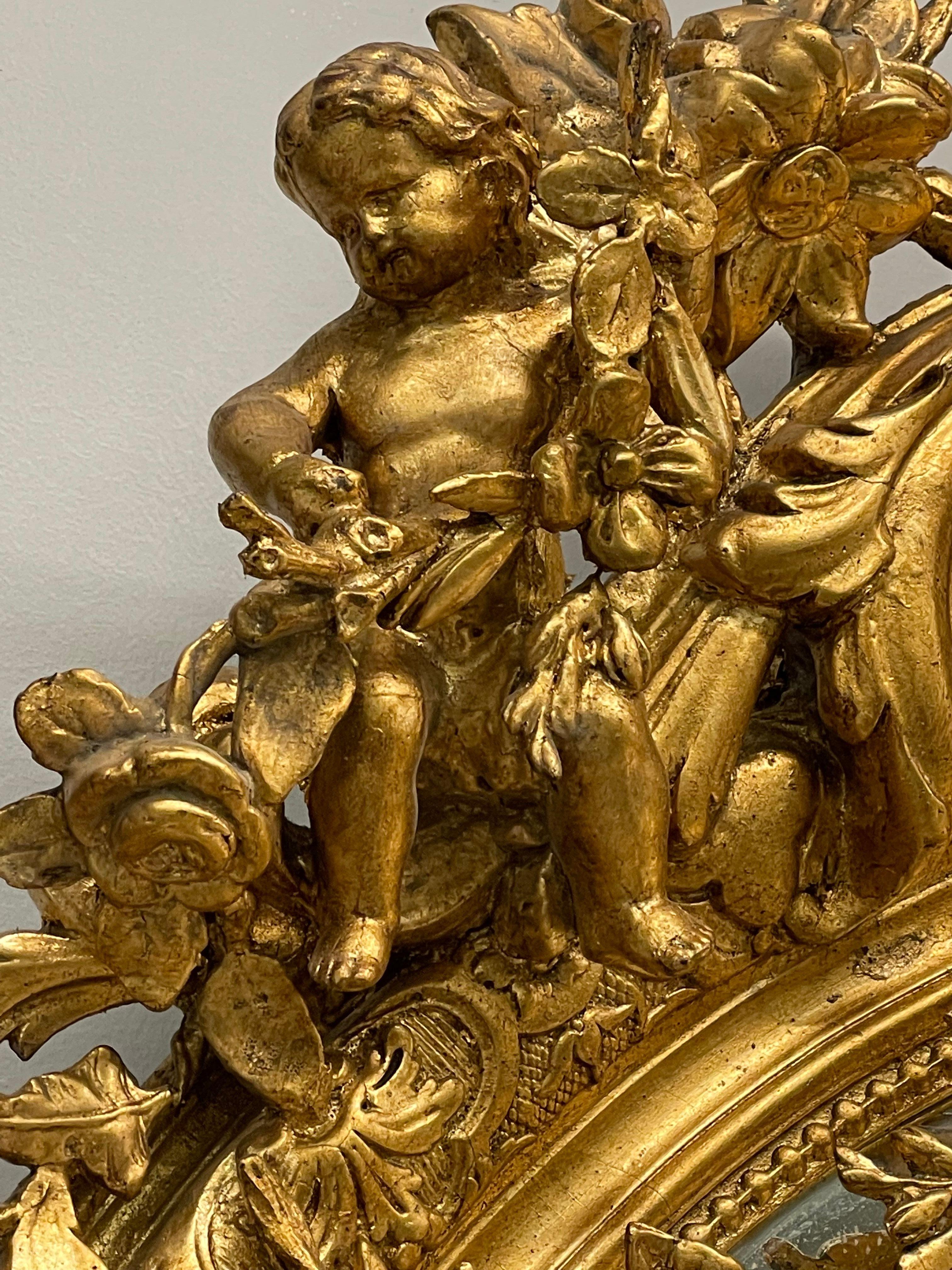 19th Century Palatial Giltwood Wall or Console Mirror Adorning Three Cherubs For Sale 5