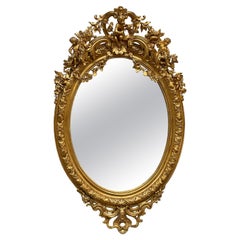 19th Century Palatial Giltwood Wall or Console Mirror Adorning Three Cherubs