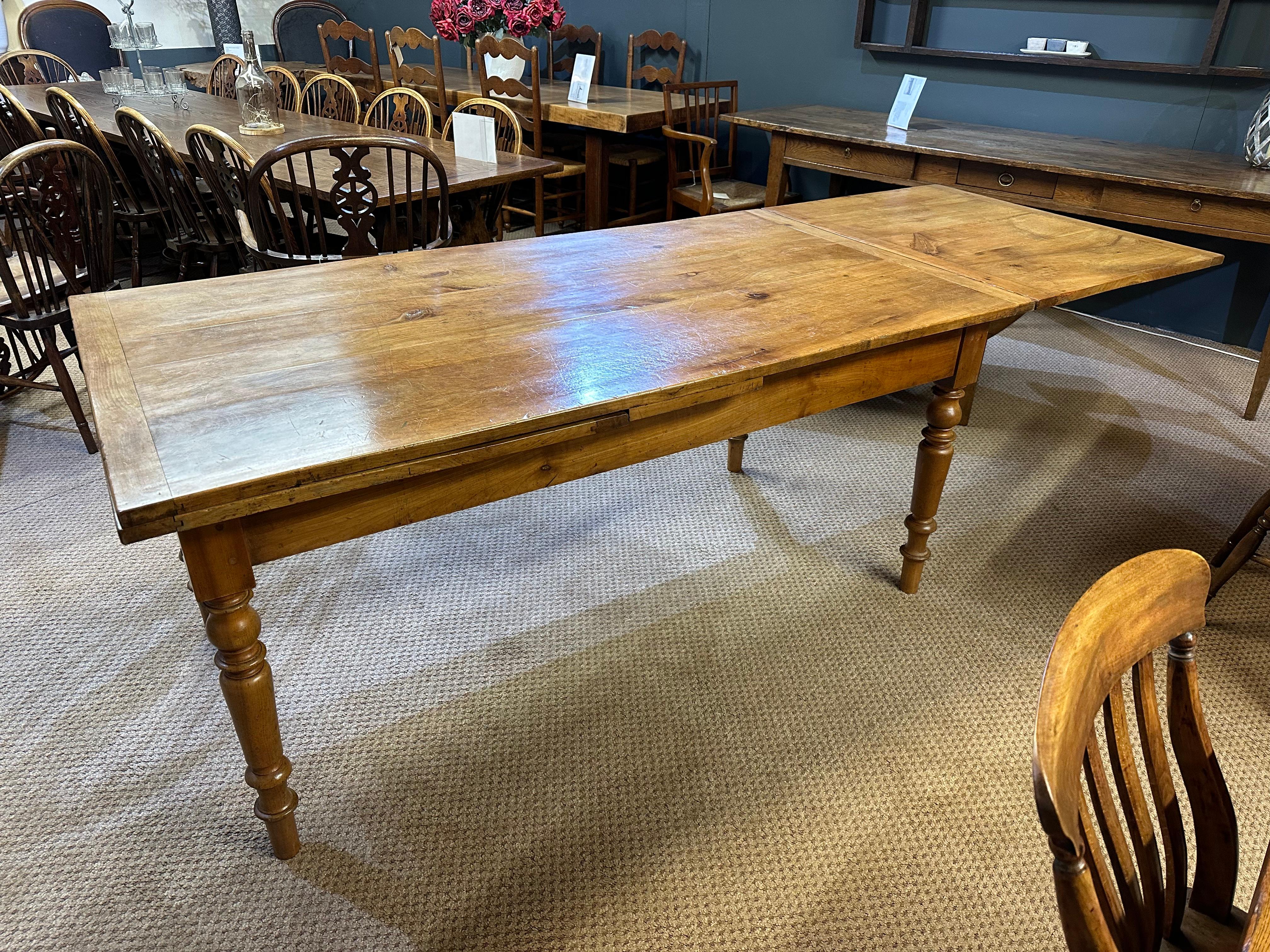 19th Century Pale Cherry Double Extending Farmhouse Table with side drawer and round legs. The table has wonderful pale colour and patination. When the table is fully extended it is 124.5