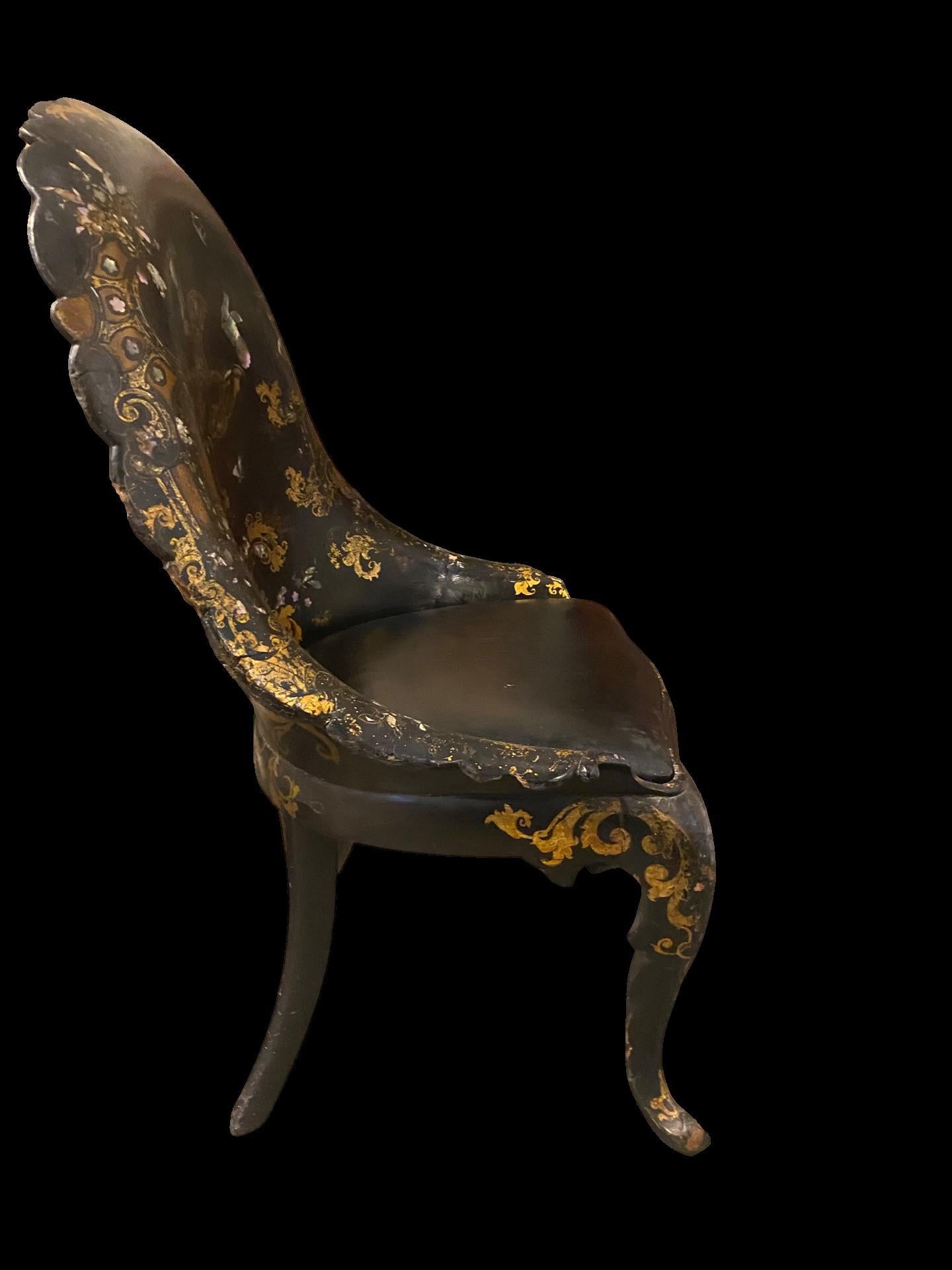 19th century Papier-mâché chair with gold leaf detail and mother of pearl inlay.
