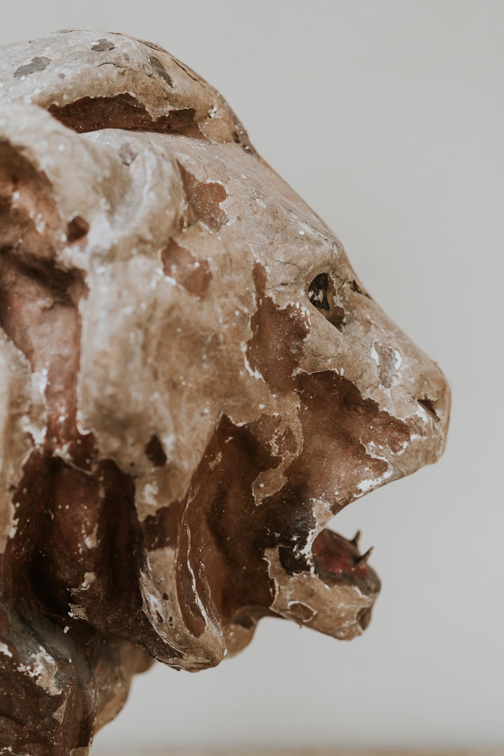 Great lines on this very decorative object, a lion made in papier mâché in France during the 19th century.