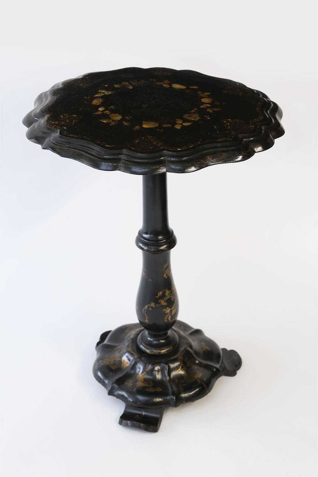 19th century ebonized papier mâché table: English ebonized wood and papier mâché table. Hand painted with mother of pearl inlay.