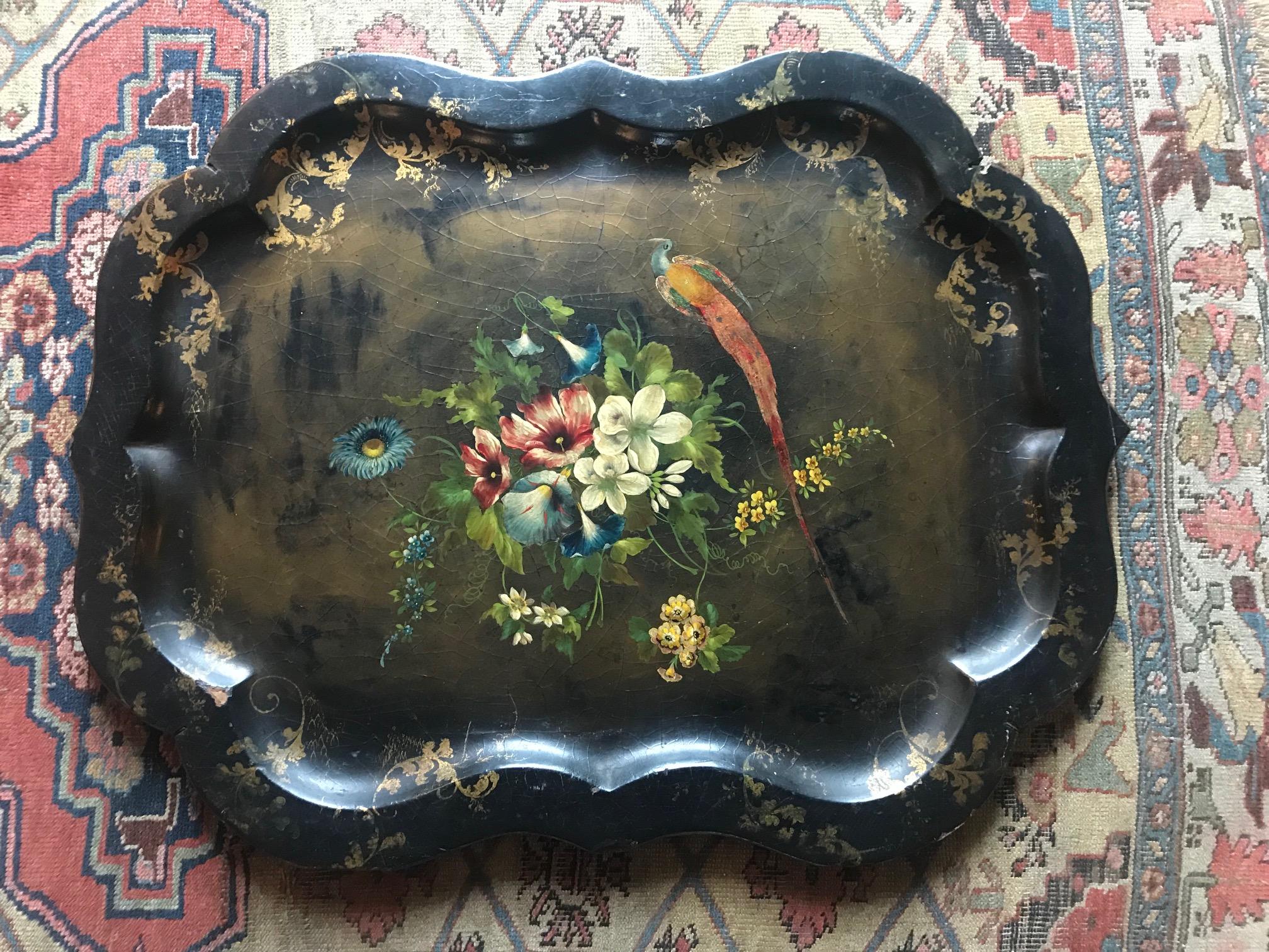 A beautiful decorative papier mâché tray with floral decoration. Some minor damage to the rim and signs of restoration. Please look at the photos carefully so you can see the damage.