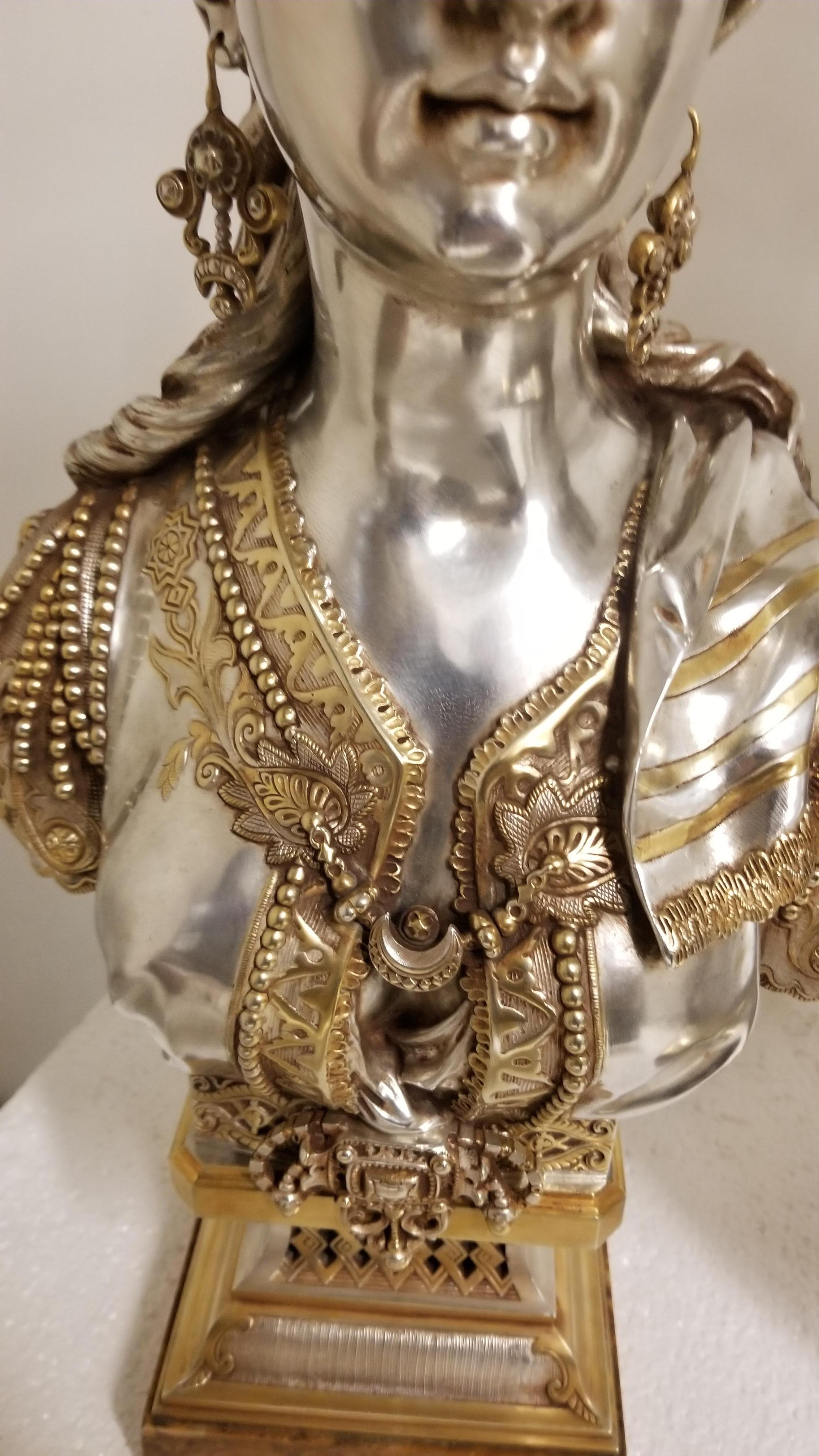 An original and exquisite French 19th-century silver-plated and parcel gilt bronze bust of an Orientalist woman on onyx base embodying the fascination with Eastern aesthetics prevalent in that era. Stamped Picard, 
The combination of gilt bronze and