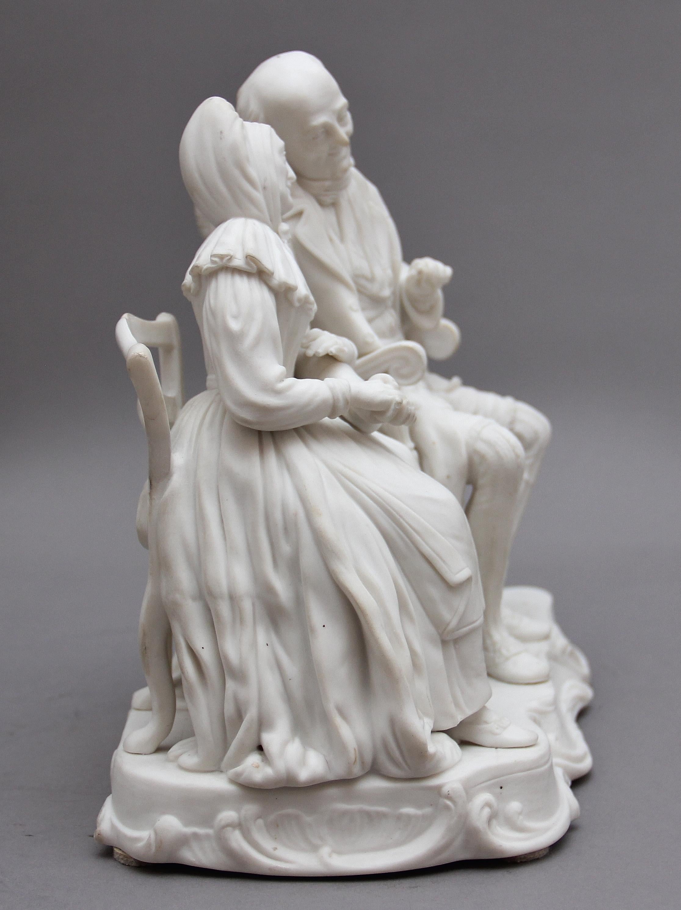A highly decorative and detailed 19th century Parian figure group of a Dickensian couple, the couple sitting in their own chairs with a cat and dog beside them, the base is marked “John Anderson My Jo” Circa 1850.

 