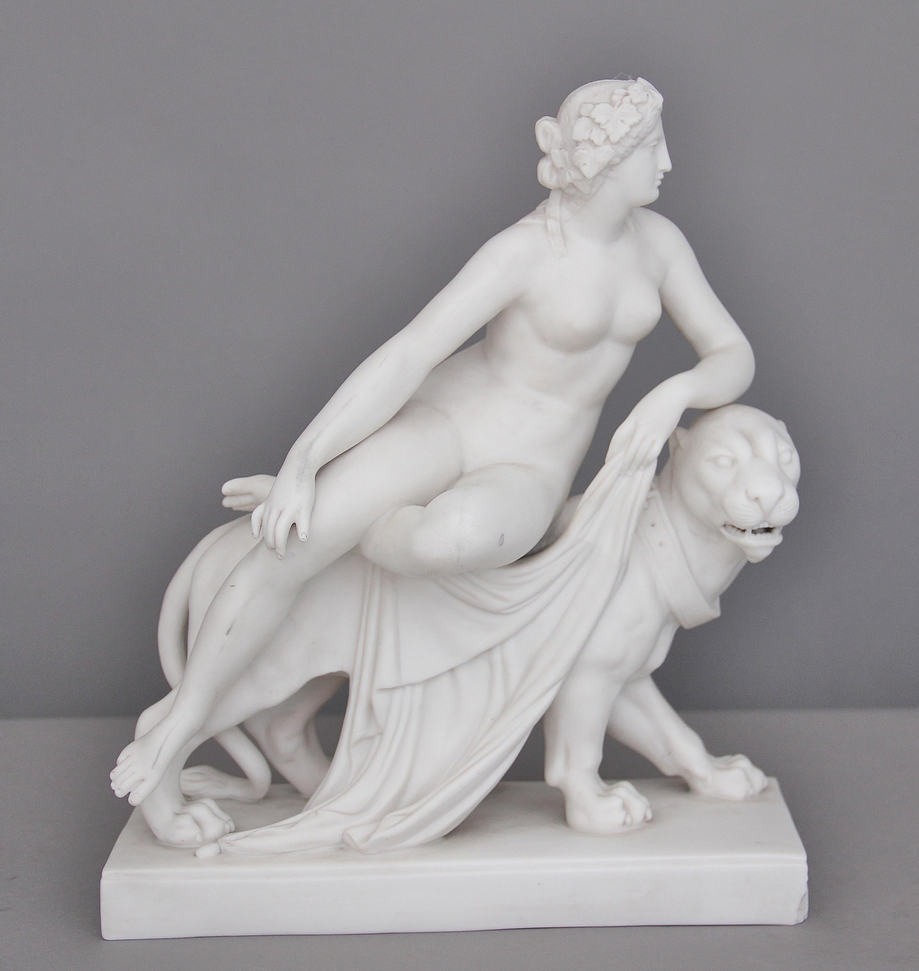19th Century parian classical figure of Ariadne and the panther, with nude female figure of riding on the panthers back, supported on a rectangular base.  Circa 1860.
