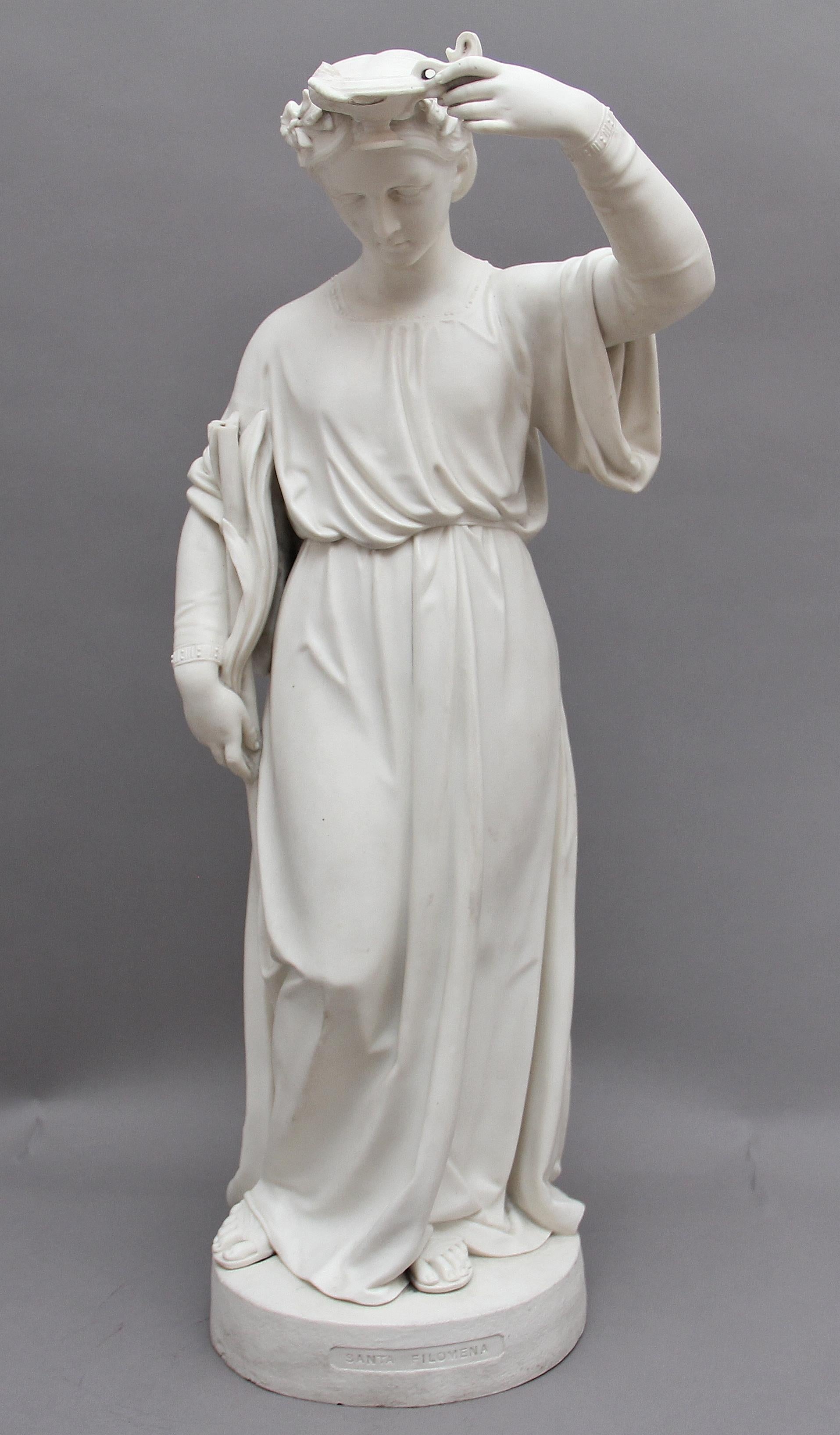 A lovely quality 19th century parian figure of the lady with the lamp which is associated with Florence Nightingale, here she is standing on a base holding a lamp up in one hand and holding what looks like to be a staff. The base is marked “Santa