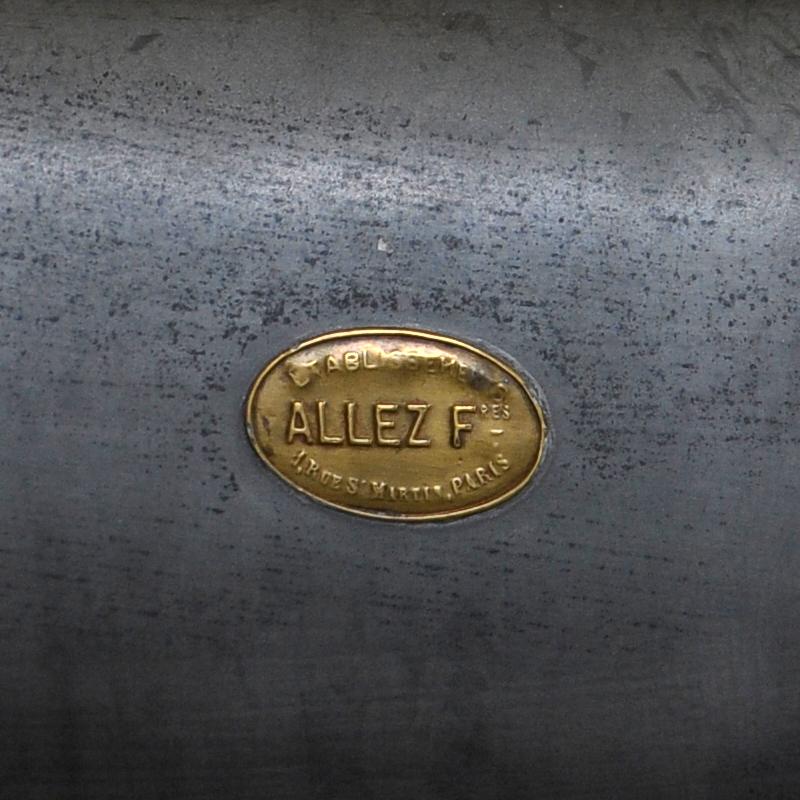 Marked in brass on zinc wall: 