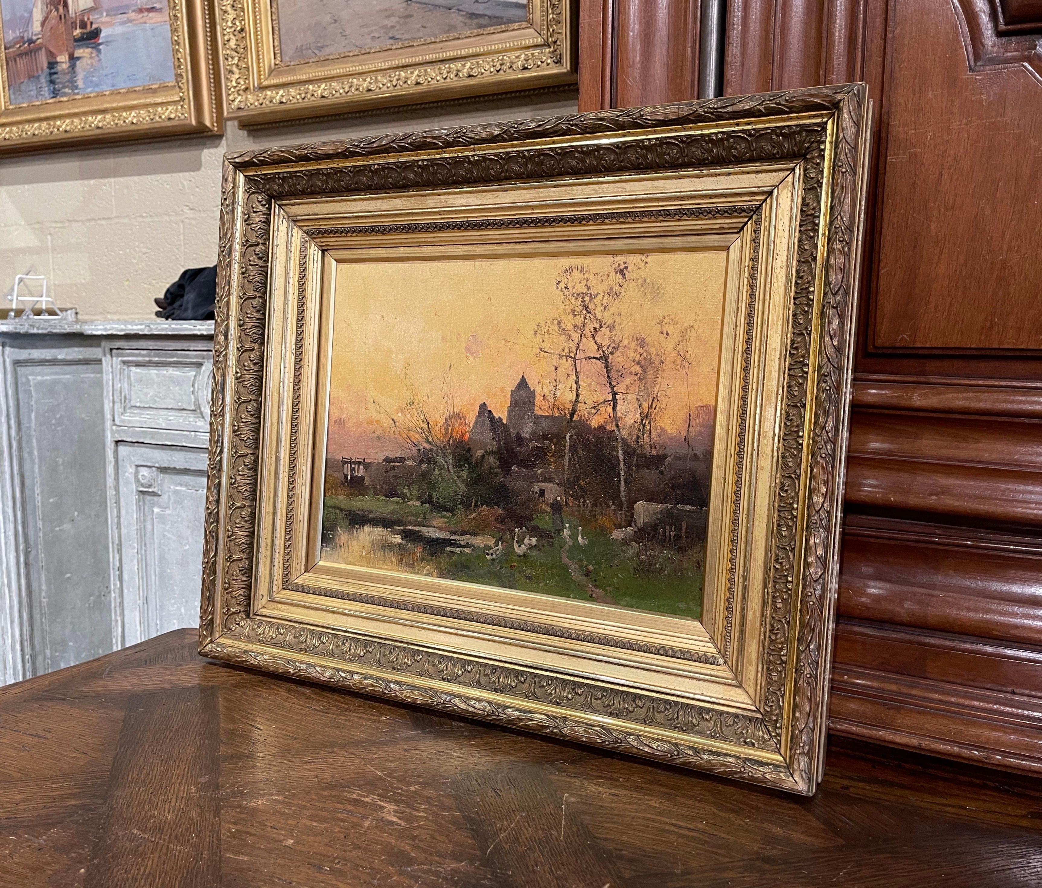 Decorate a study, living room or den with this beautiful and colorful antique oil painting! Painted in France circa 1890, the artwork is set in the original carved gilt wood frame; it illustrates a picturesque, country scene in rural France with a