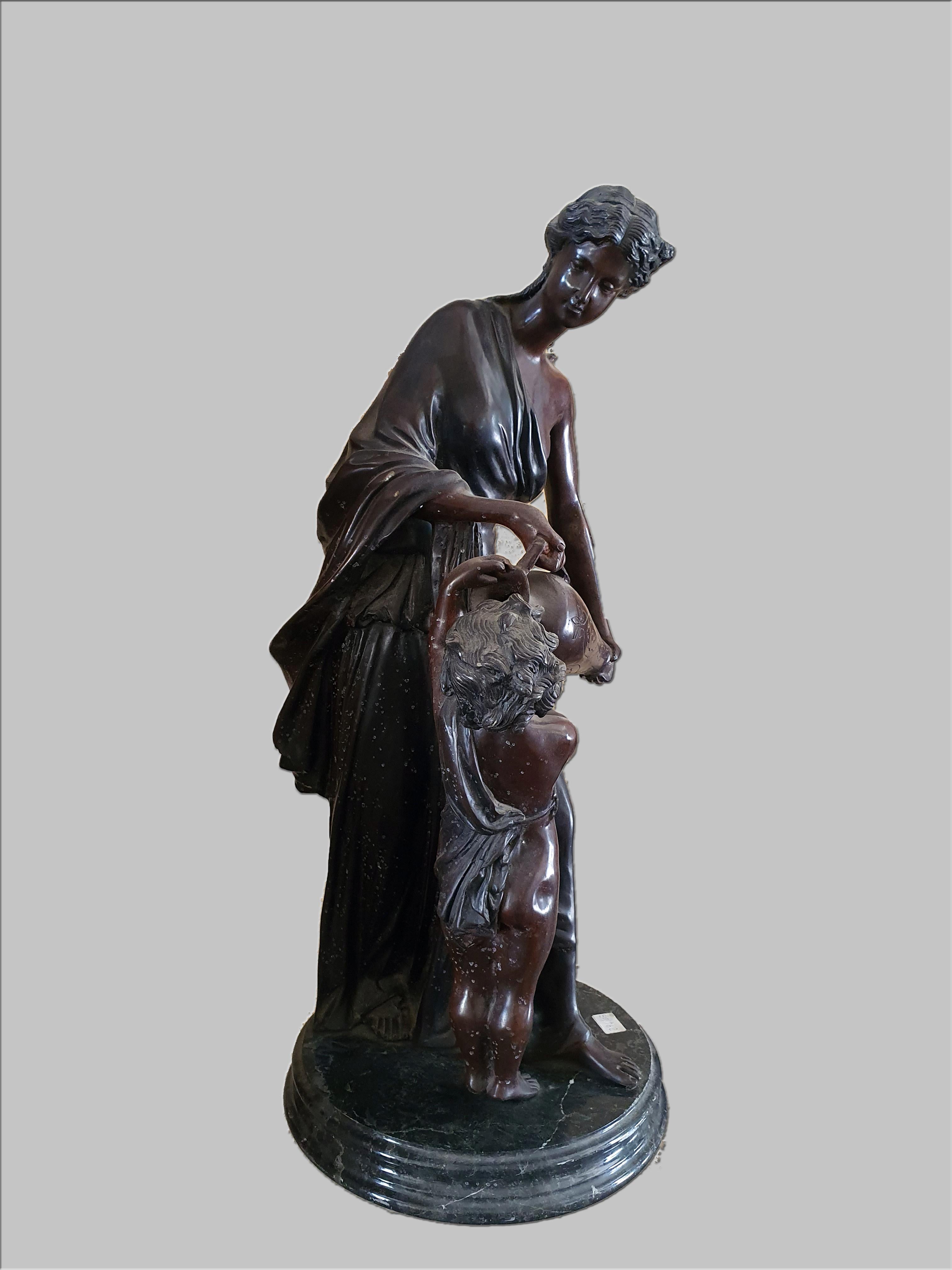 Patinated bronze sculpture depicting a lady with a pourer in her hand and a child. Marble base.
Made by Hippolyte Francois Moreau.
