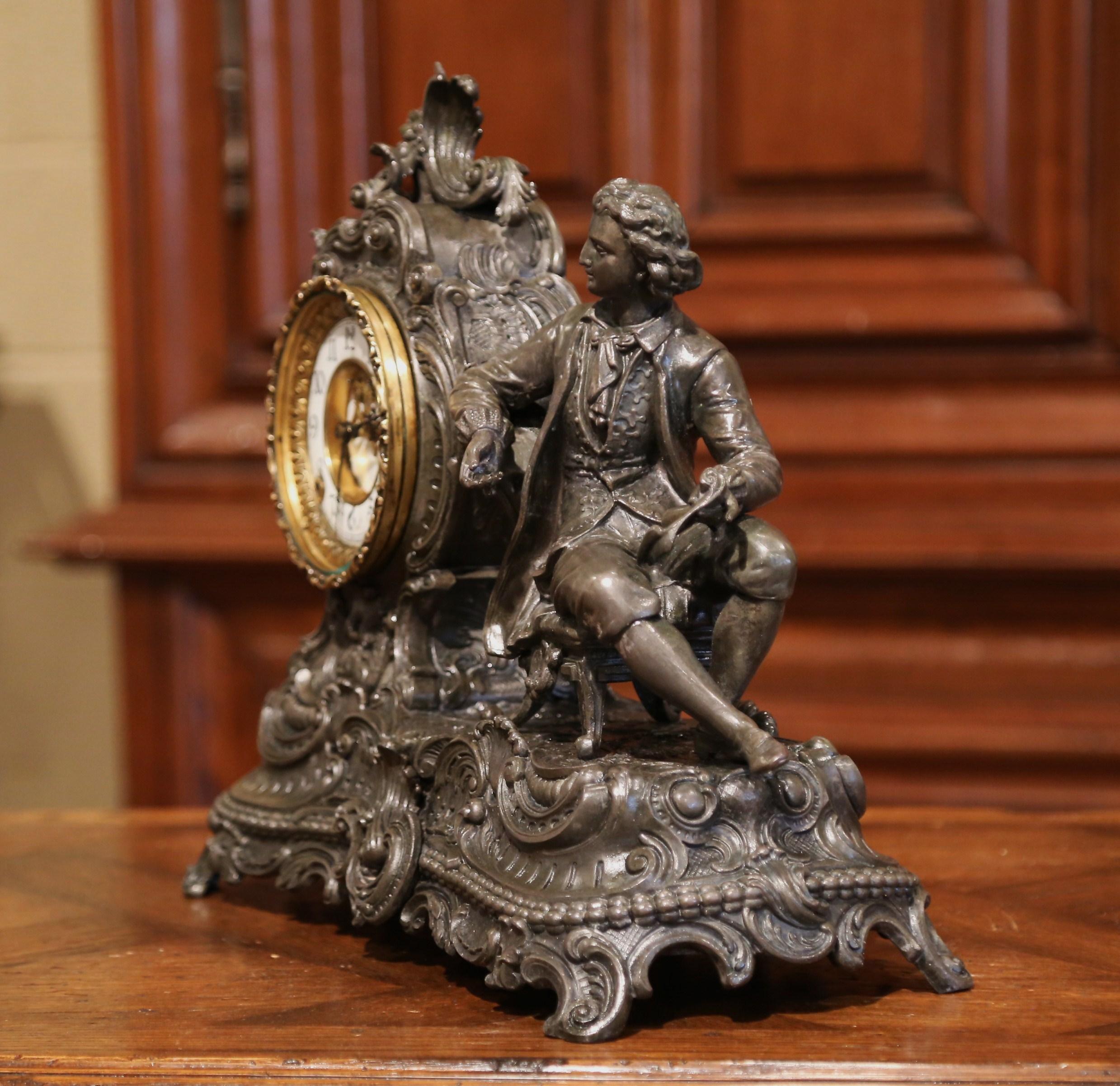 Decorate a mantel with this elegant antique clock, crafted in New York by Ansonia Clock Company and dated 1881, the clock stands on curved feet and features a carved sculpture of the French physicist Denis Papin sited on a chair. The intricate clock