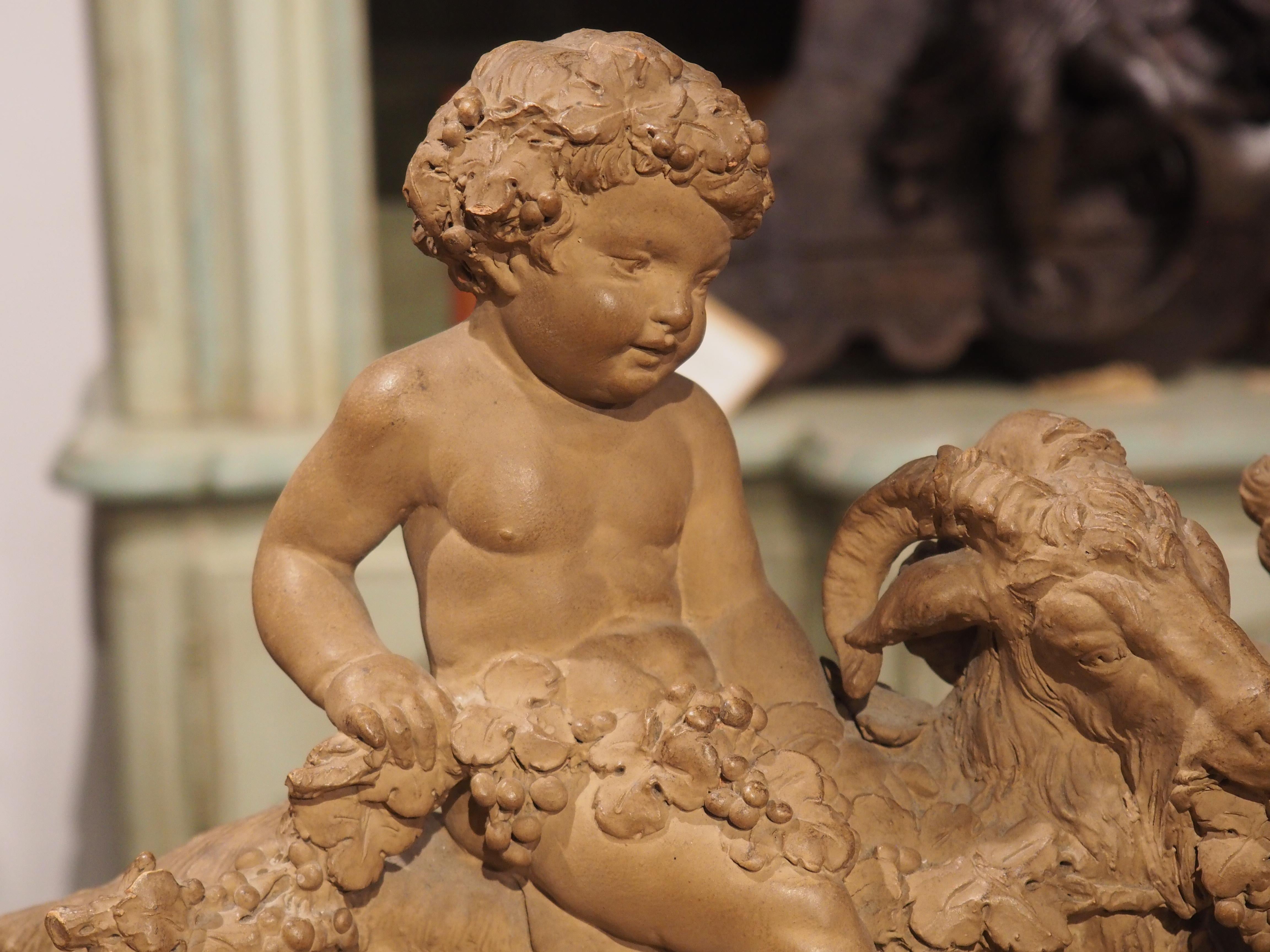 Neoclassical 19th Century Patinated Terra Cotta of Bacchanalian Putti Playing with Goat For Sale