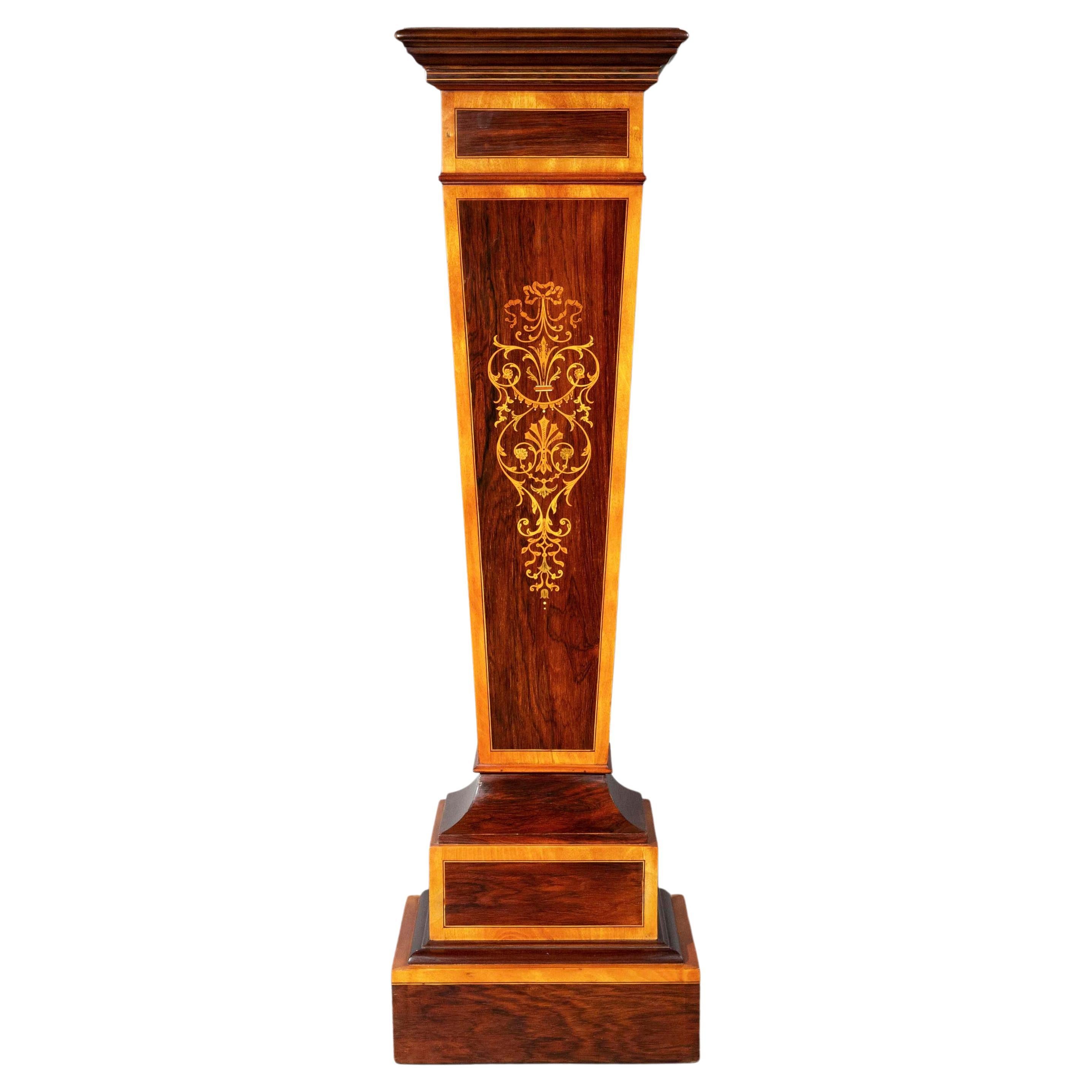 A superbly decorative Neoclassical revival pedestal stand from the Victorian era, beautifully veneered in contrasting woods.

England, late 19th century, circa 1880–1890.

Why we like it
We love its clean lines and the intricacy of the contrasting