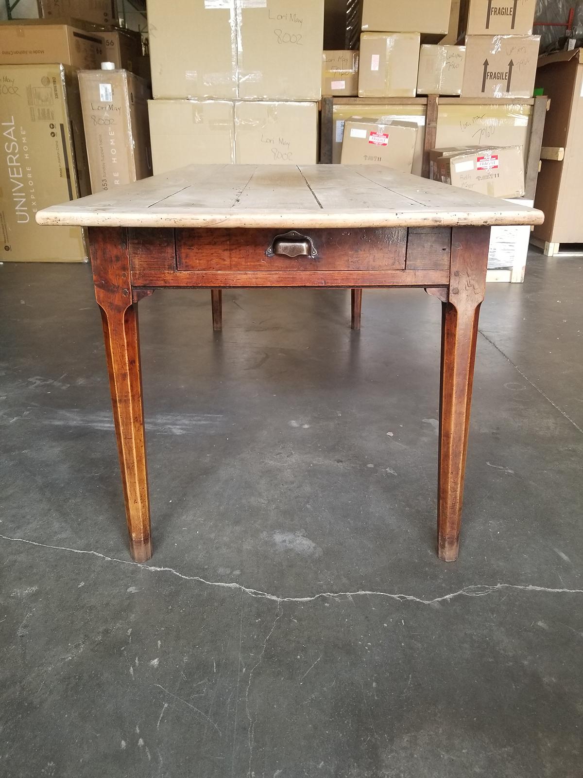 19th century pegged farm table with natural plank top, two utensil drawers.