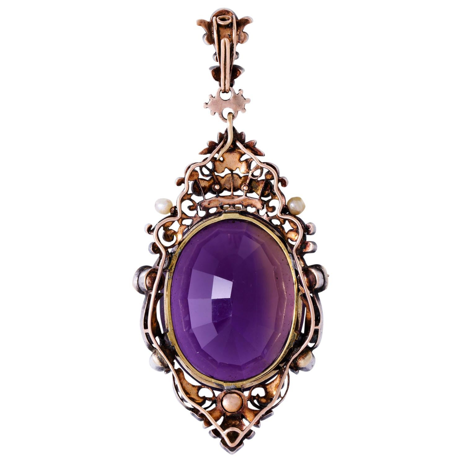 Oval Cut 19th Century Pendant Featuring an 45ct Amethyst under a Sapphire Crown For Sale