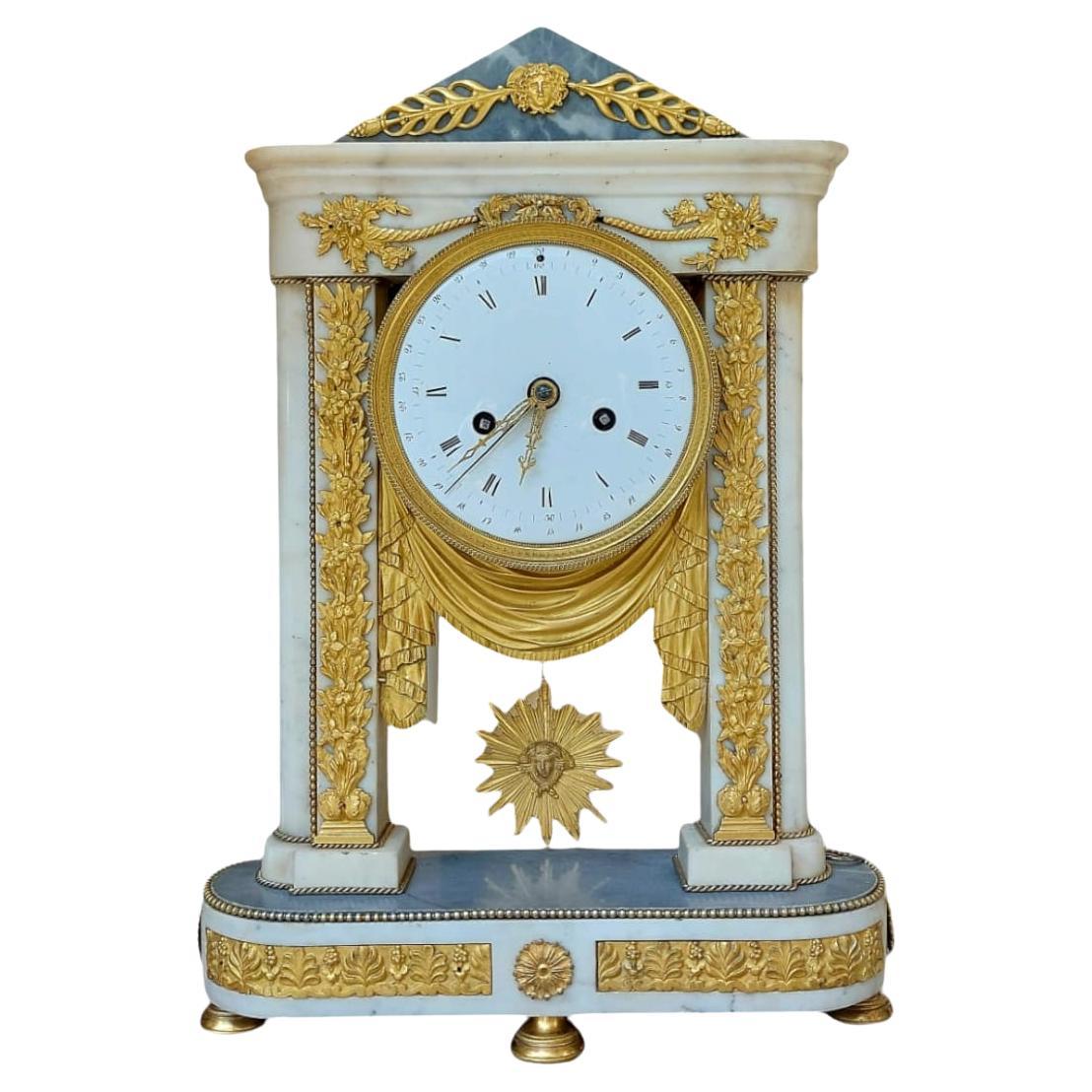 Empire period portico clock in white marble and gilt bronze, 19th century