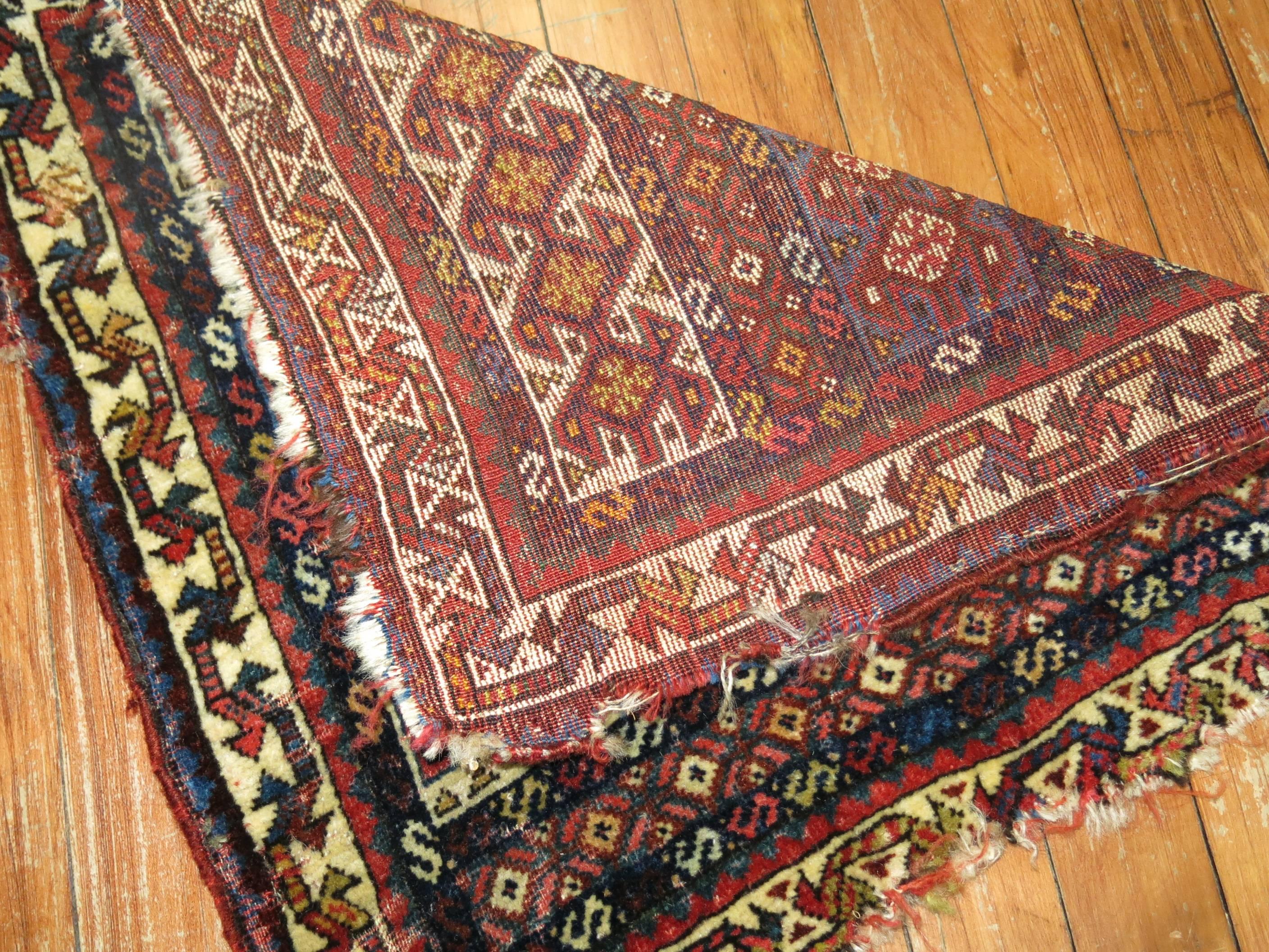 A 19th century authentic handwoven Persian tribal bagface textile rug.