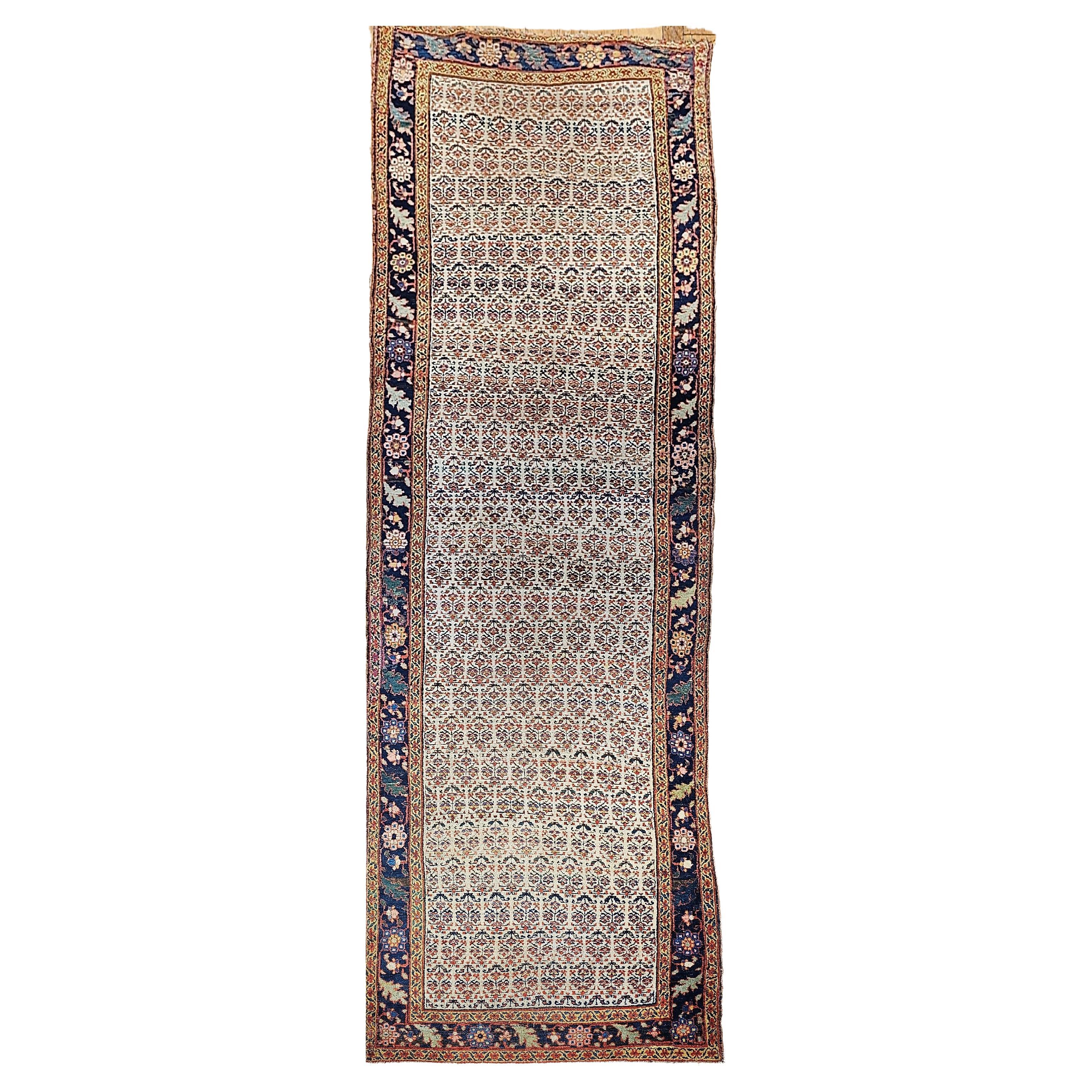 Astonishing beautiful wide Bidjar hallway or gallery runner circa the 4th quarter of the 19th century. The field is in ivory which is extremely desirable with flower heads which is considered a variation of the paisley pattern. The major border is