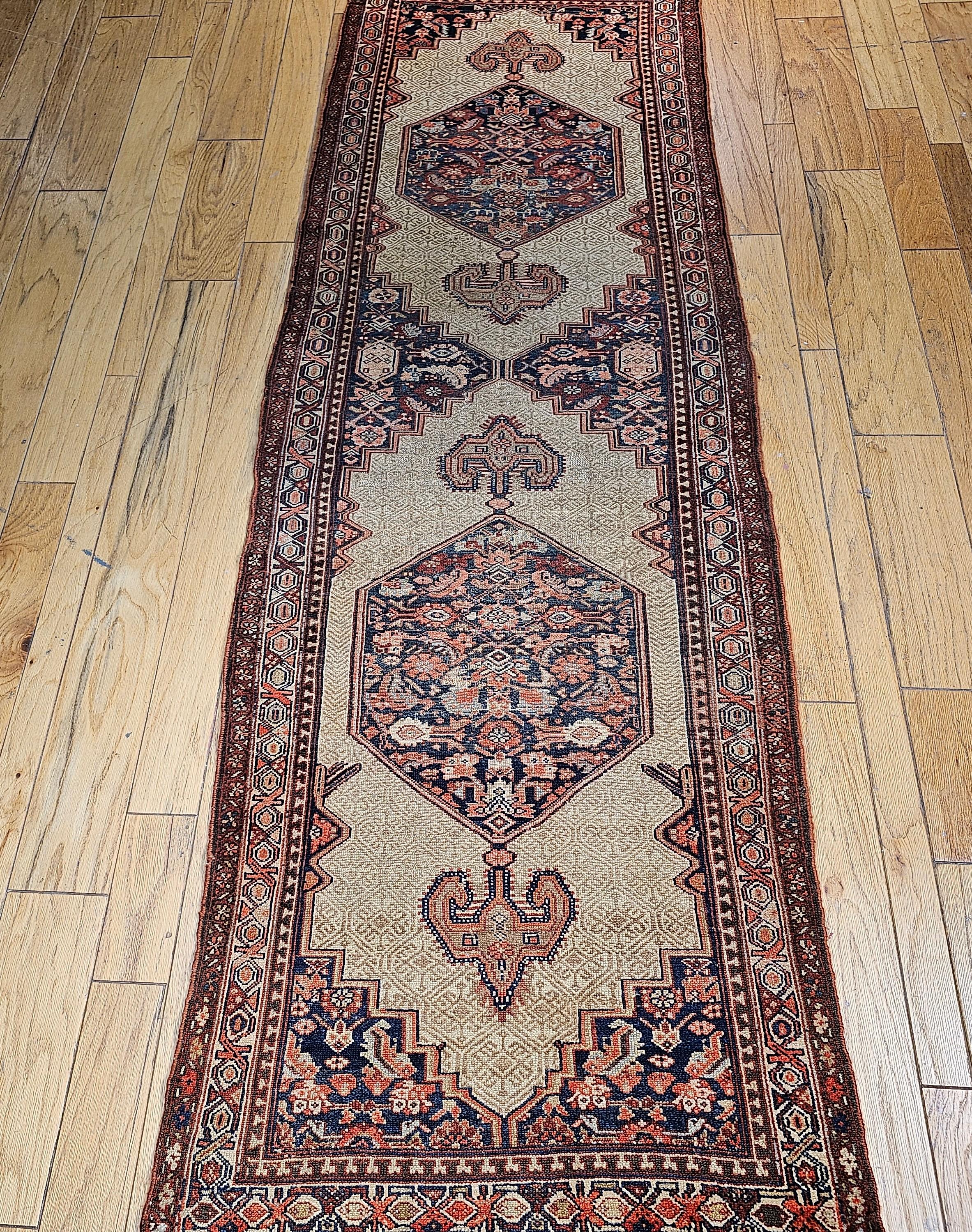 19th Century Persian Serab camelhair runner in a two medallion design.   Two abrash blue/green color hexagonal designs in a camel hair color field provide a beautiful design.  The combination of cobalt, saffron, French blue, pistachio and umber all