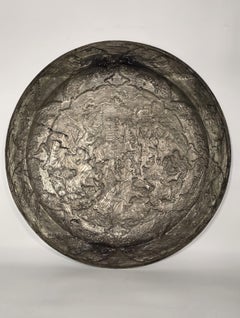 19th century Persian Empire copper charger decorated with engraved repousse work