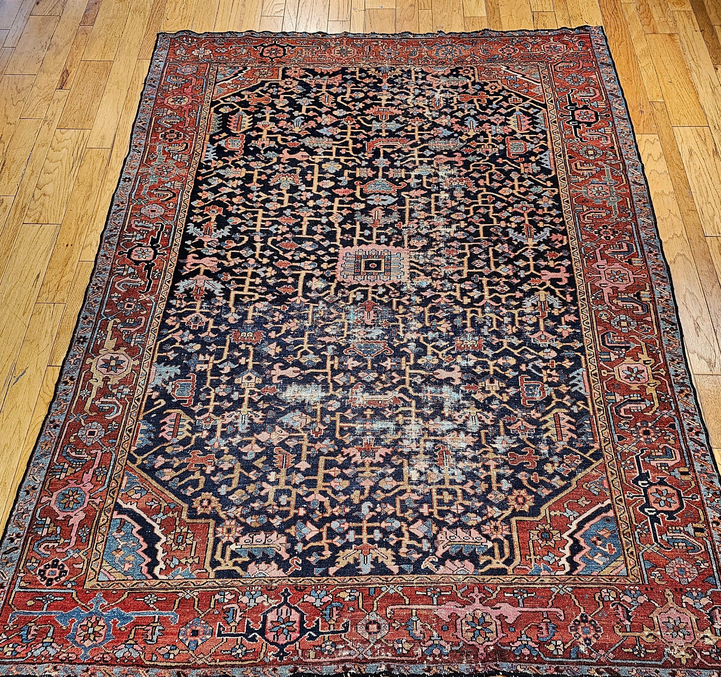 A truly exceptional and rare find, this late 19th-century Persian Heriz Serapi rug showcases an uncommon and highly desirable allover 