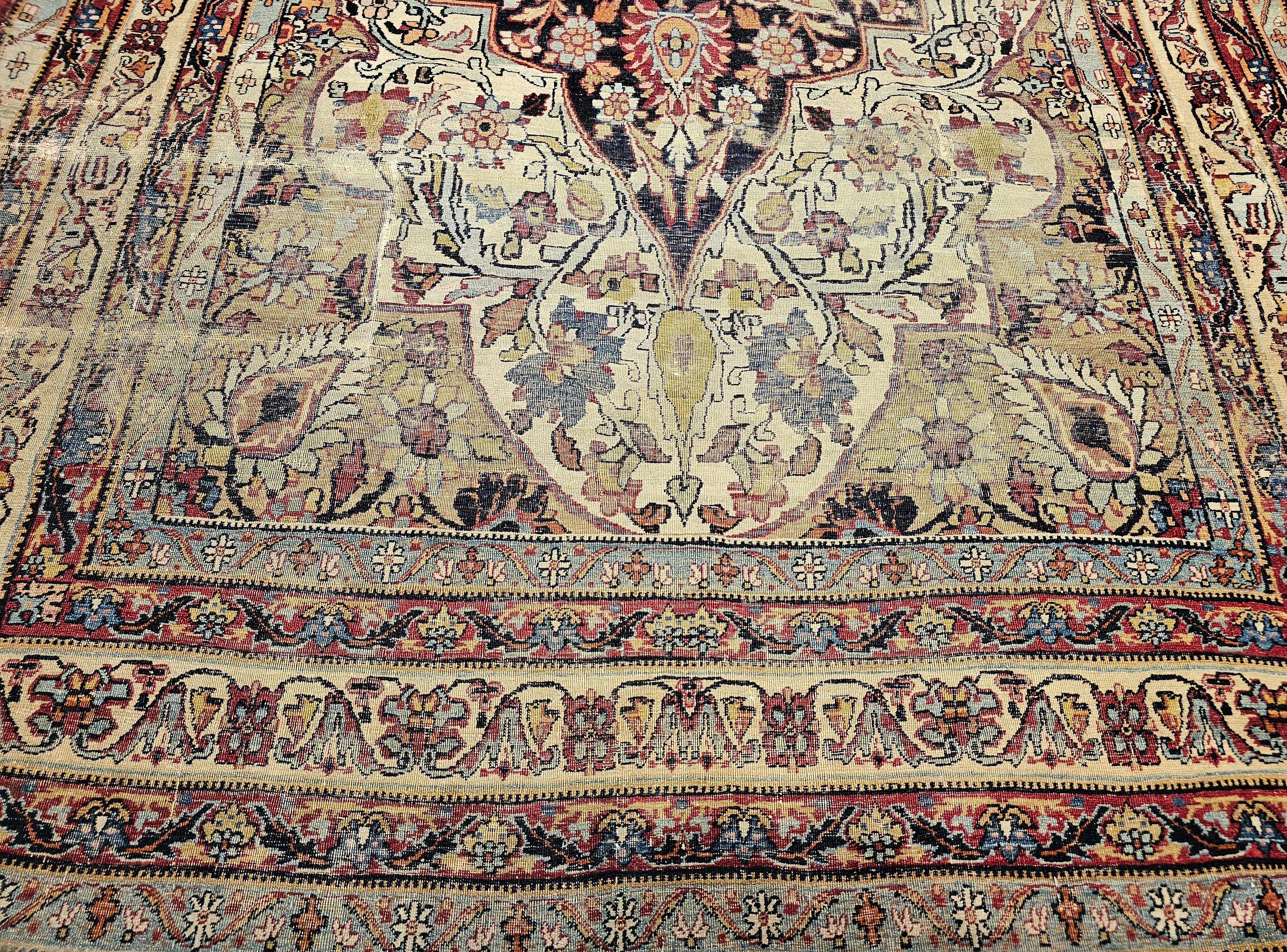 Wool 19th Century Persian Kerman Lavar in Floral Pattern in Ivory, Red, Navy, Yellow For Sale