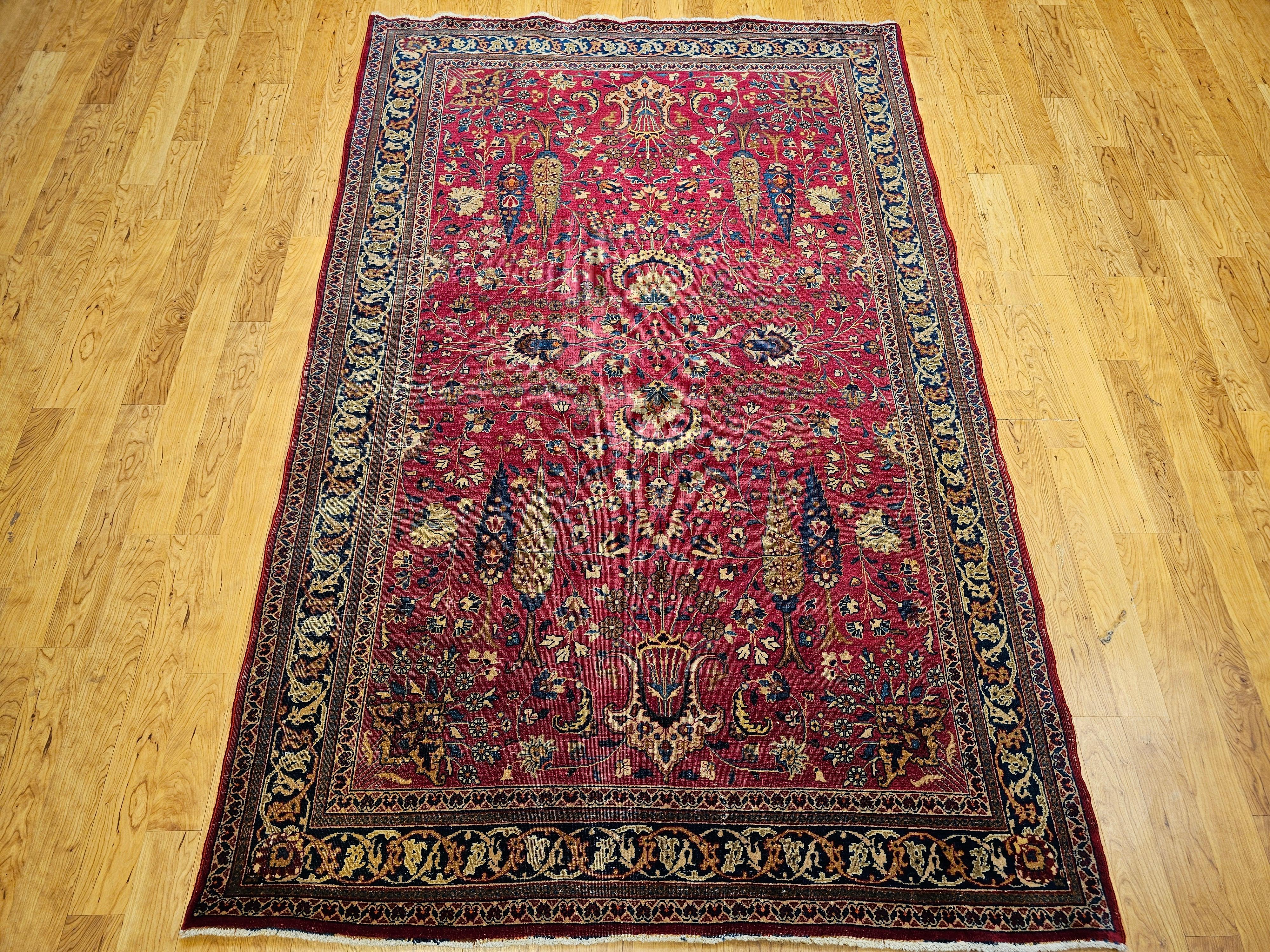 A rare and profoundly symbolic 19th century Persian Khorassan rug features an extraordinary allover “Tree of Life” pattern, rendered in a vibrant palette of crimson red, deep blue, and verdant green. Woven in the northeastern Persian province of