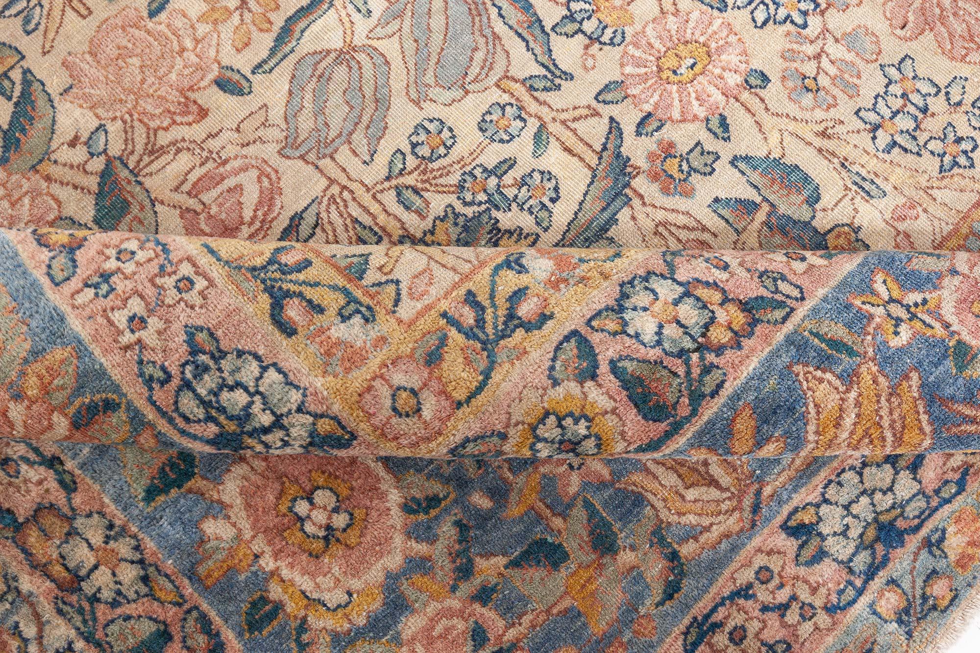 19th century Persian Kirman floral handwoven wool rug
Size: 11'2