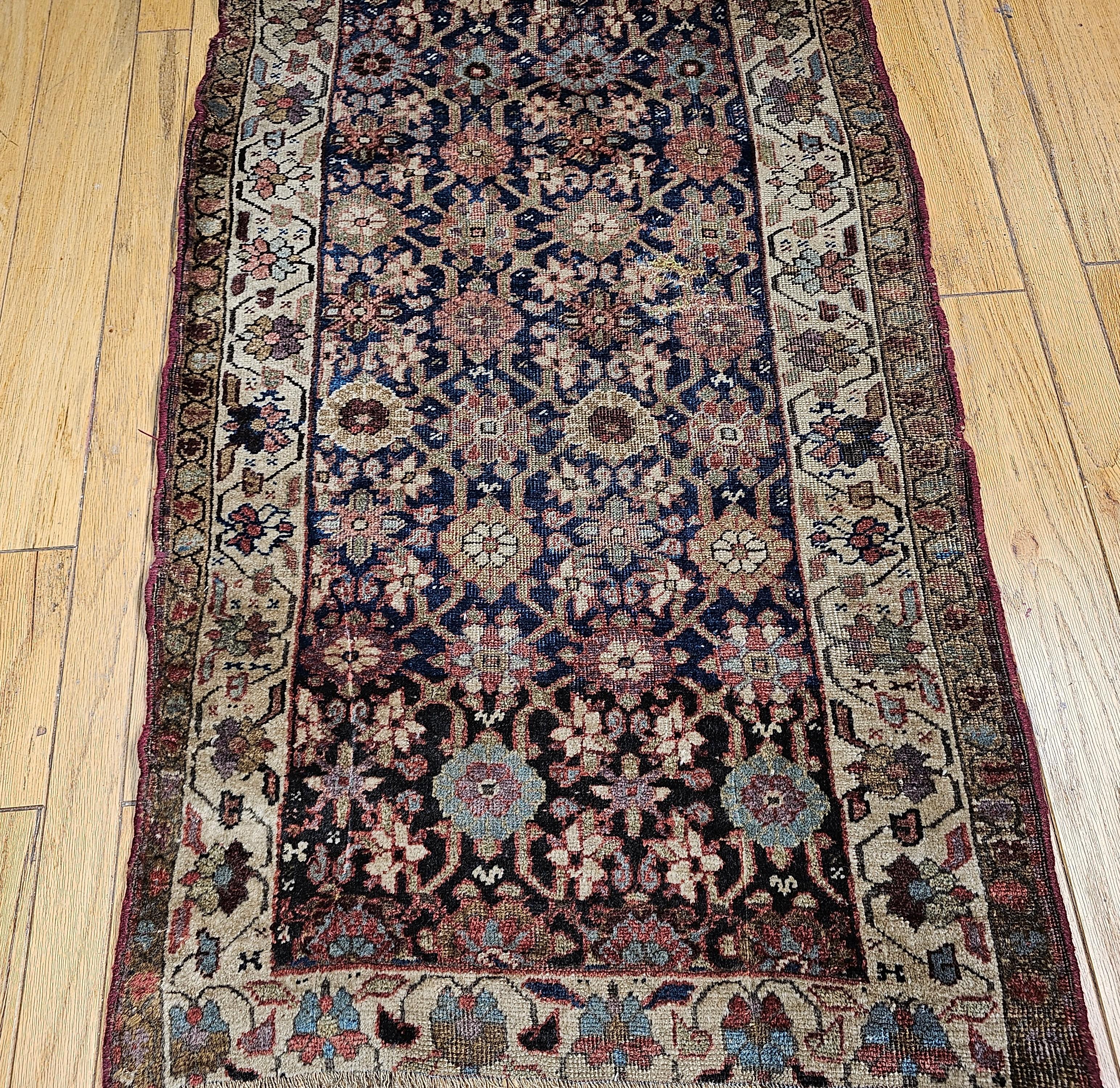 19th Century Kurdish Bidjar runner in an allover “Mina Khani”  rosettes pattern.  The wonderful small runner  has a beautiful combination of colorful flowers throughout. The abrash blue color in the main field shows the traditional way the village