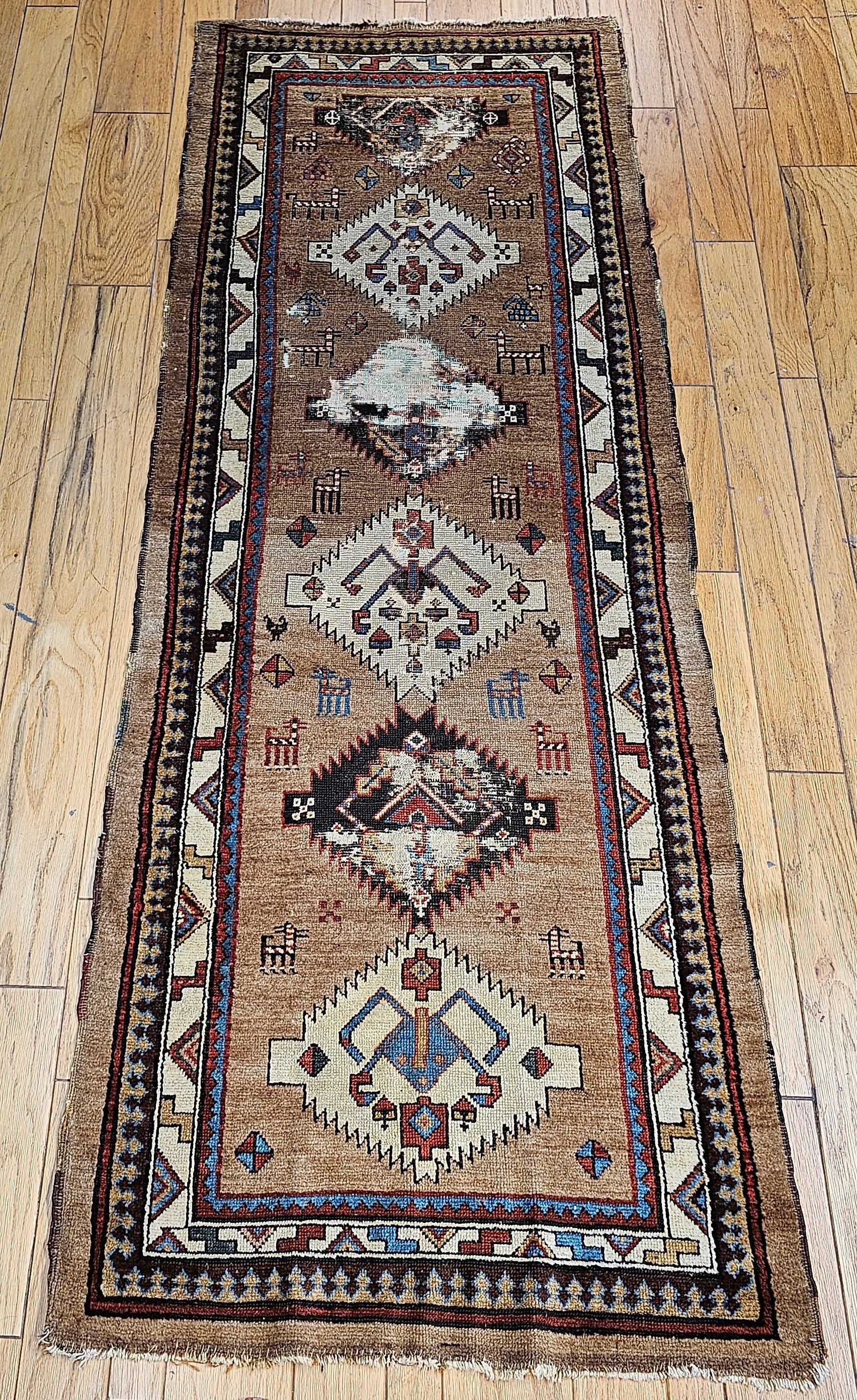 Beautiful Persian  Kurdish camelhair runner in a geometric pattern circa the late 19th century.  The camelhair rugs and runners are rare and are some of the most sought-after by homeowners and interior design professionals who appreciate the rarity