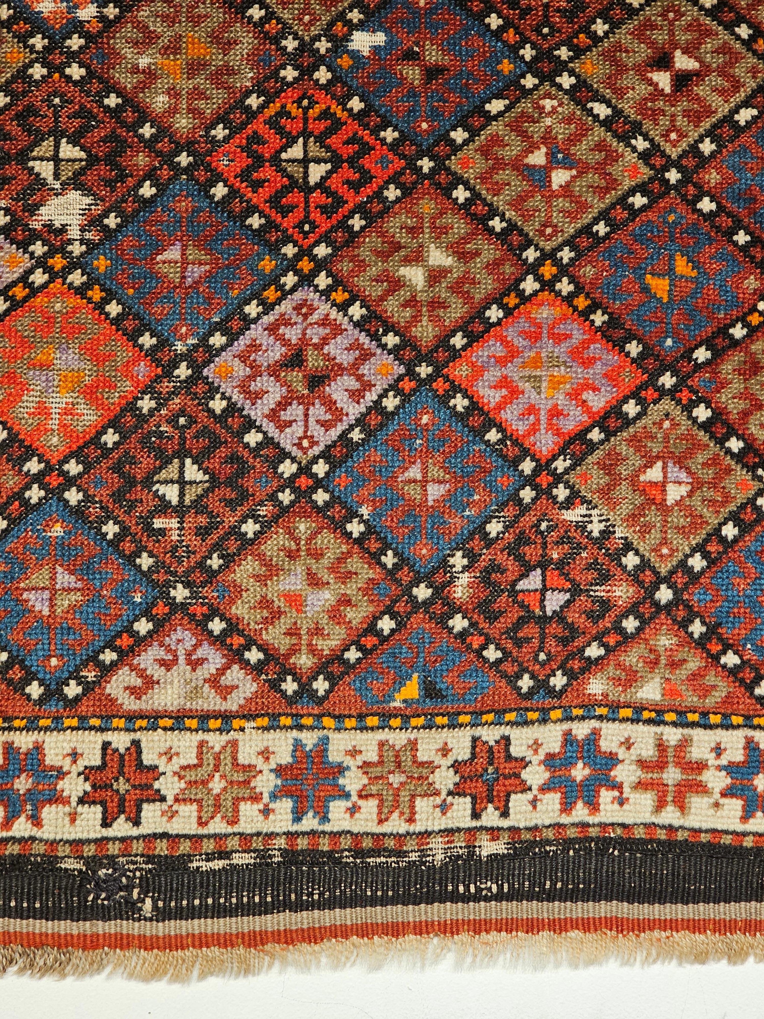 19th century Persian Kurdish Tribal Bagface in Multicolor Geometrical Design Used as Nomadic Wall Art. It could have been either the face of a saddlebag or the side panels for a mafrash (large bag). It has kilim weaving and the soumak woven designs