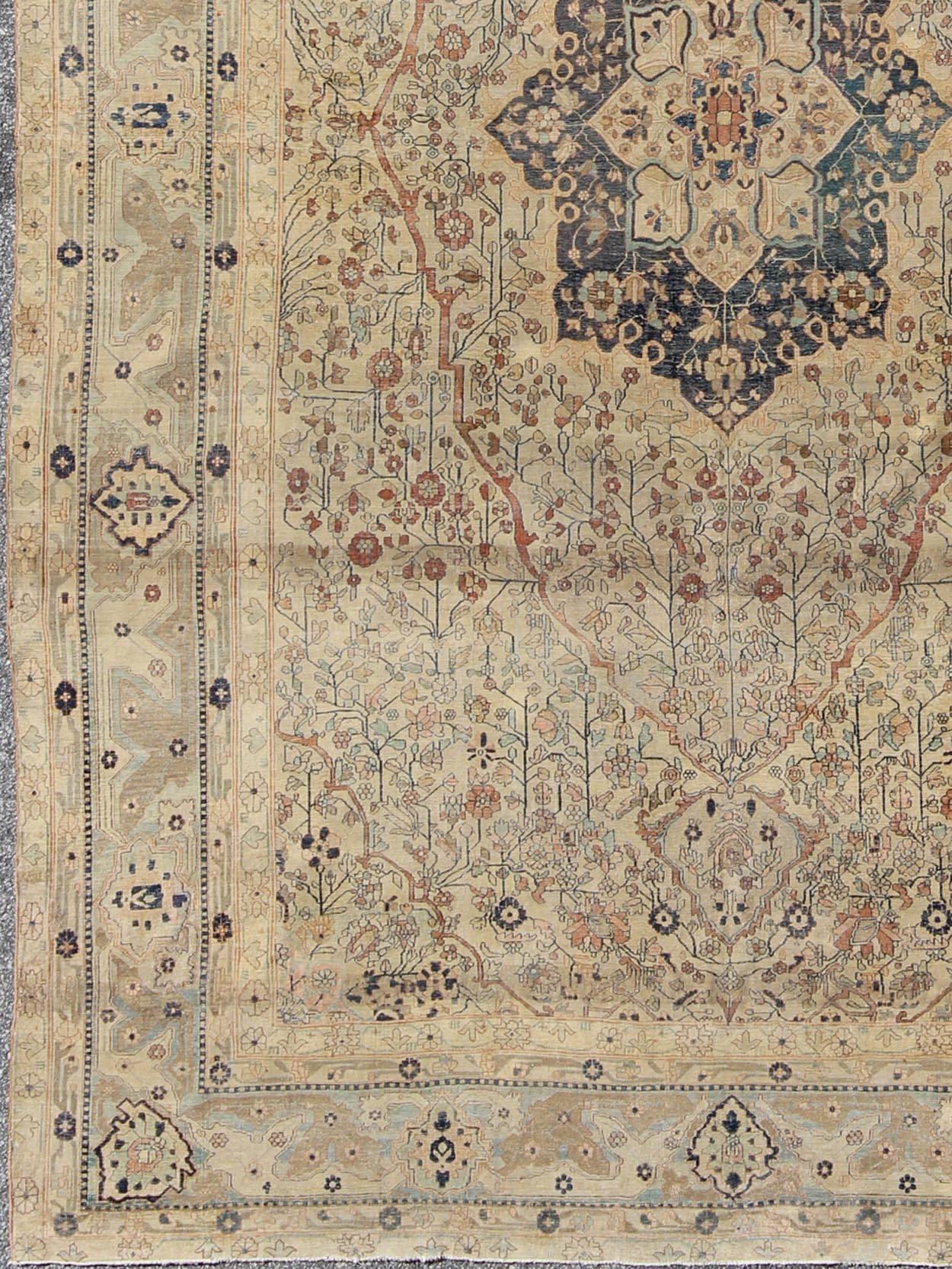 Antique 19th century Persian Mohtesham Kashan rug in cream and light blue, light green, taupe, khaki and dark blue, rug / 16-0701, 8'1 x 12'1 Antique Mohtesham Kashan Rug. Named after its master weaver and crafter, this antique Mohtasham rug is one