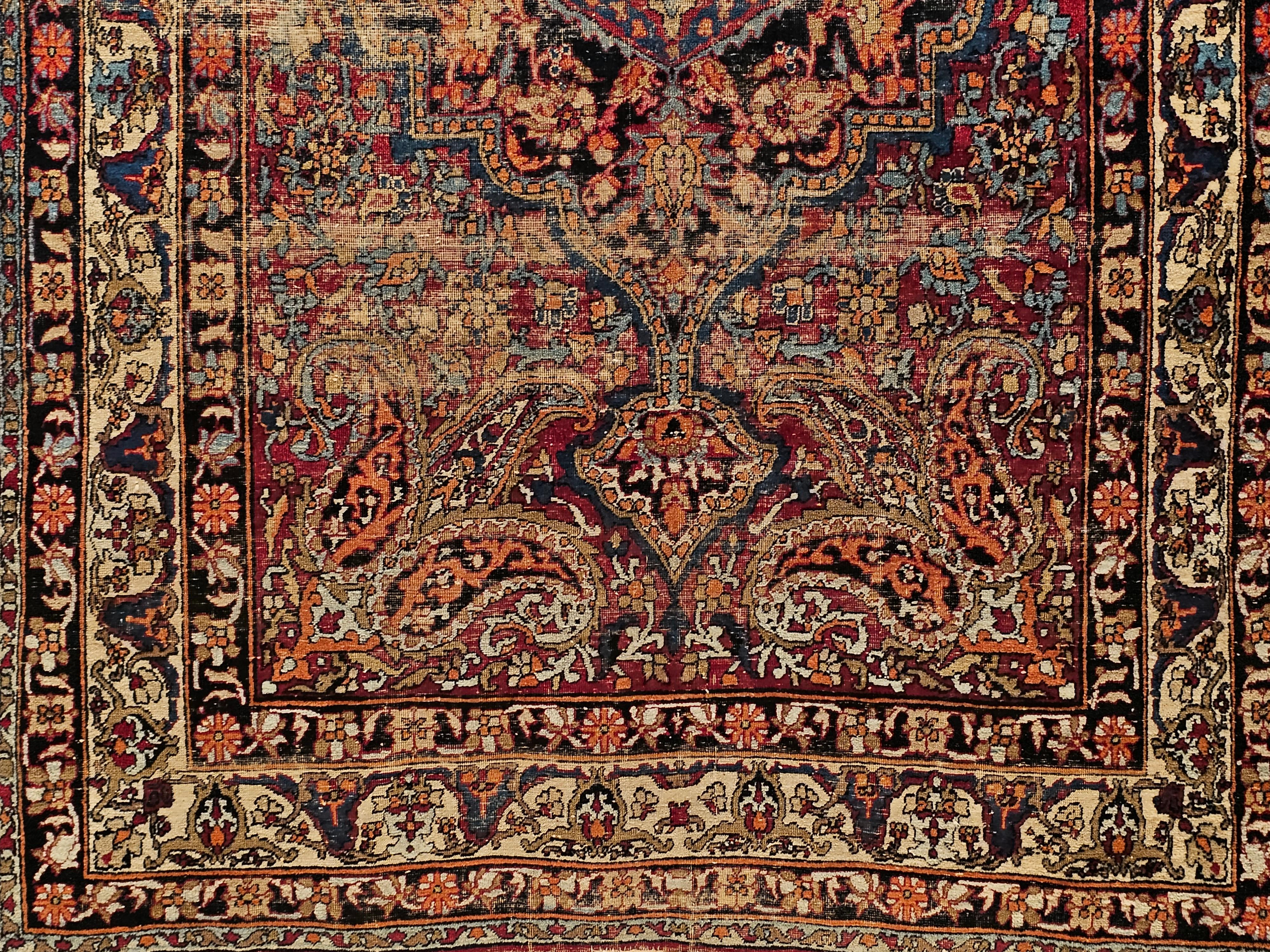 A 19th century Persian Silk Kashan area rug in floral/medallion design set on a red  field. The design and the color combination clearly demonstrates the mastery of the art of weaving in Kashan in this period.  There is a central extended medallion