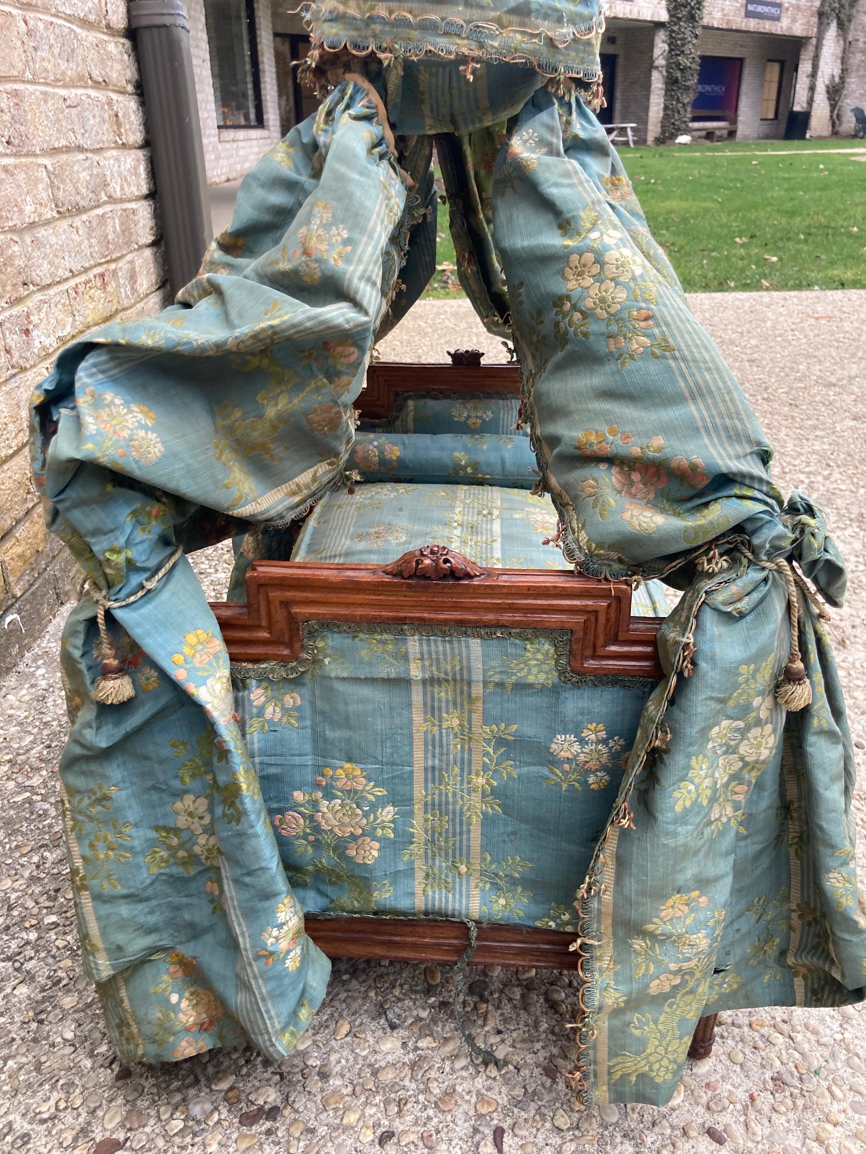 Exquisite pet/ doll bed in the Louis XXI style. all original silk brocade drapery and upholstery. and remnants of trims. mattress is stuffed horsehair. ostrich feather floret. (the height of 32
