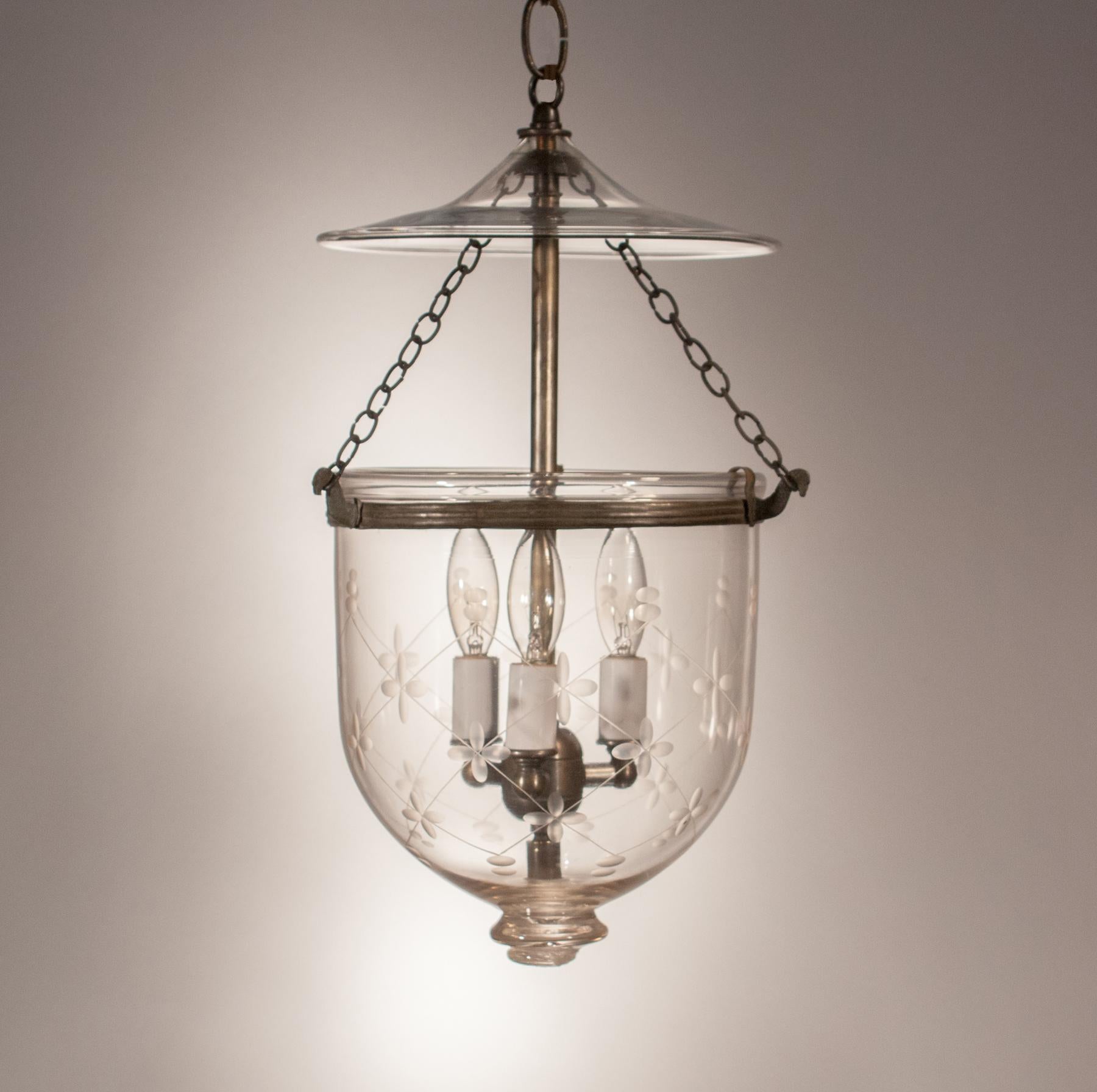 Every bell jar lantern has its own distinct character. This charming, circa 1890 pendant is no exception. Manufactured by S&C Bishop of England, the lantern has the Bishop mark on its pontil. It also has its original smoke bell and rolled brass