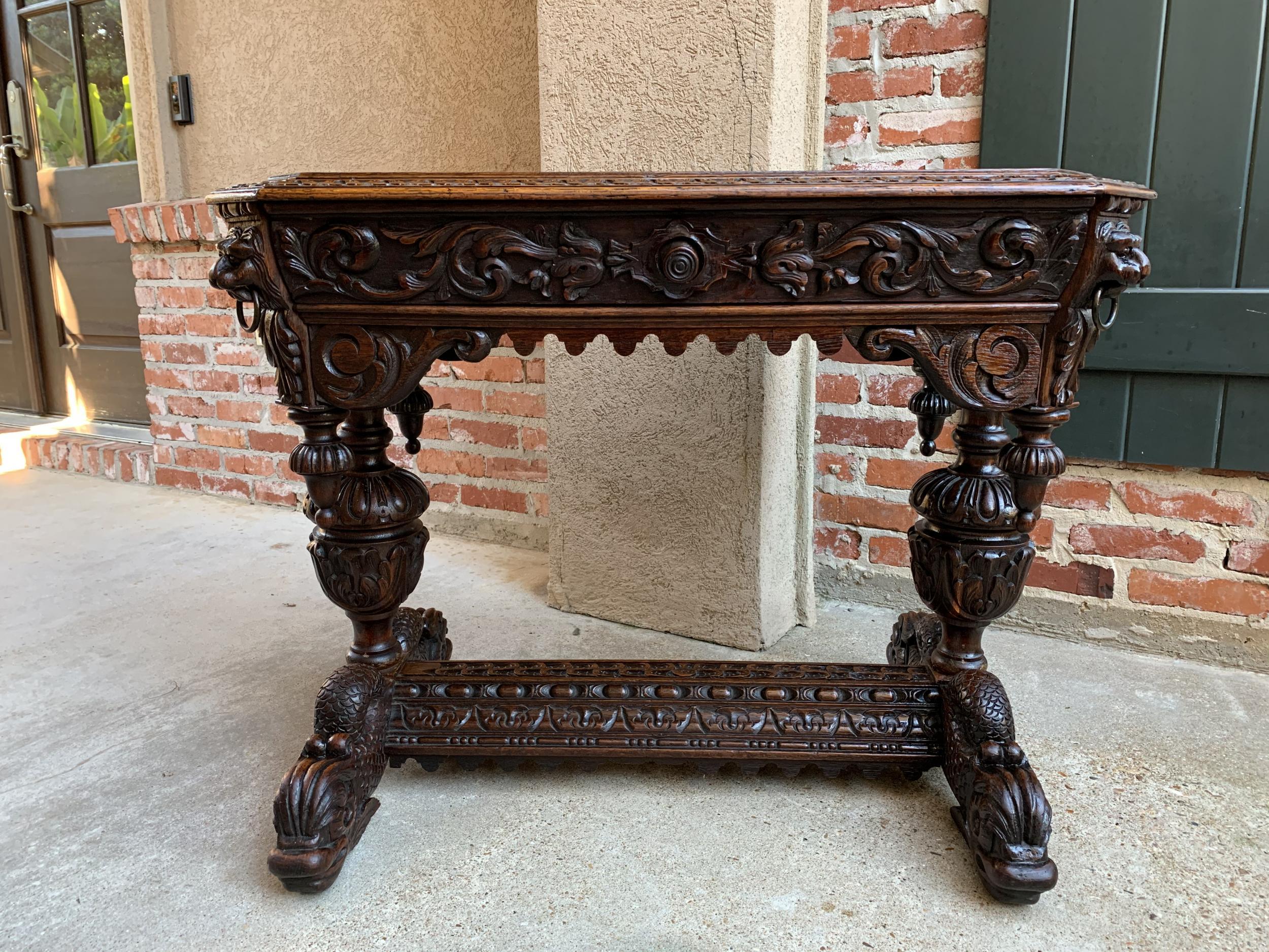 19th century Petite French carved oak dolphin table desk renaissance gothic

~Direct from France~
An elegant antique French carved library table or 