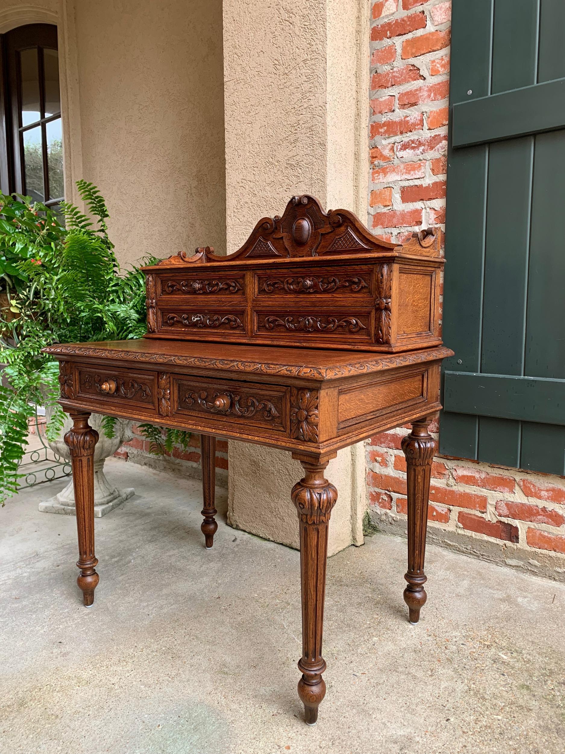 19th century Petite French carved oak secretary writing desk Louis XVI style

~Direct from France~
~Beautiful antique French carved oak secretary with fabulous detailing throughout~
~Large upper crown features center dimensional carved cartouche and