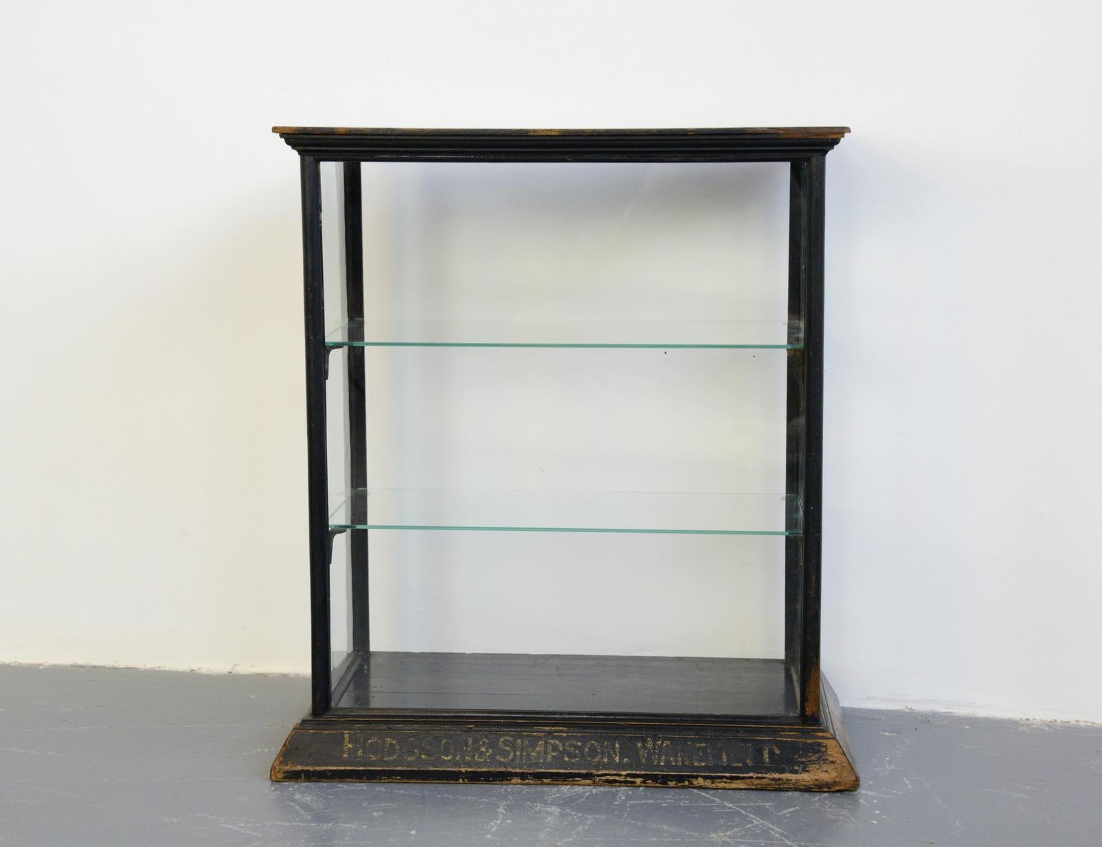 19th century pharmacy display cabinet Hodgson & Simpson soap

- Ebonized oak frame
- Glass windows and shelves
- Would have originally sat on a pharmacy counter to display soap
- Original gold lettering reads 