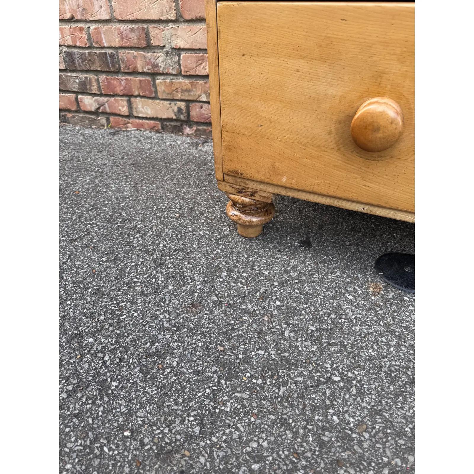 This is a very rare English pine Bow Front Pine chest of drawers. This piece dates to the 19th century and has lovely patina. The wood has a warm glow, that is accented perfectly by the original wooden knobs. This chest is two over two design with a