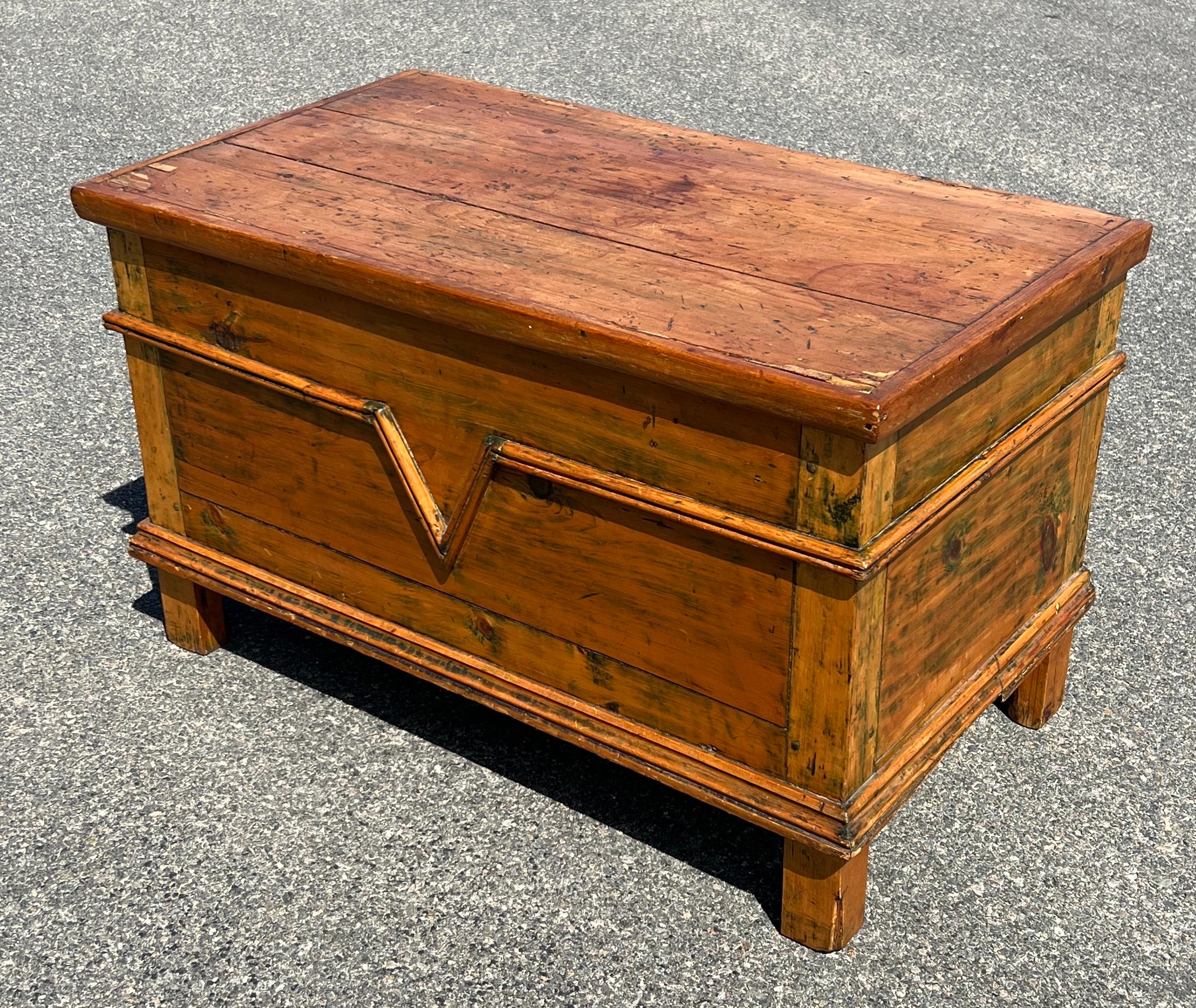 19th Century yellow pine coffer with traces of green paint. Applied molding with central 