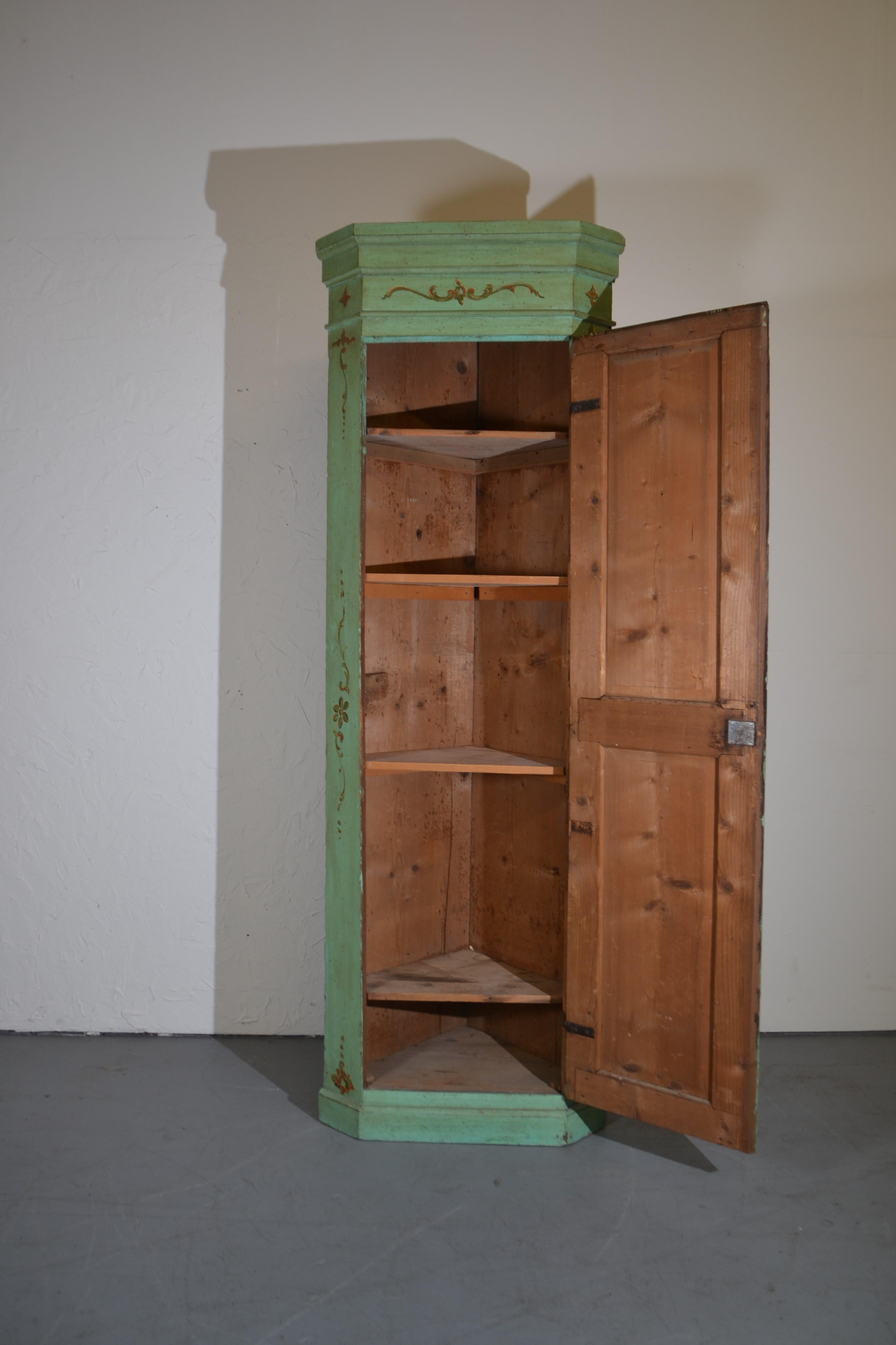 19th century French hand painted corner cupboard. A single door opens to five shelves.