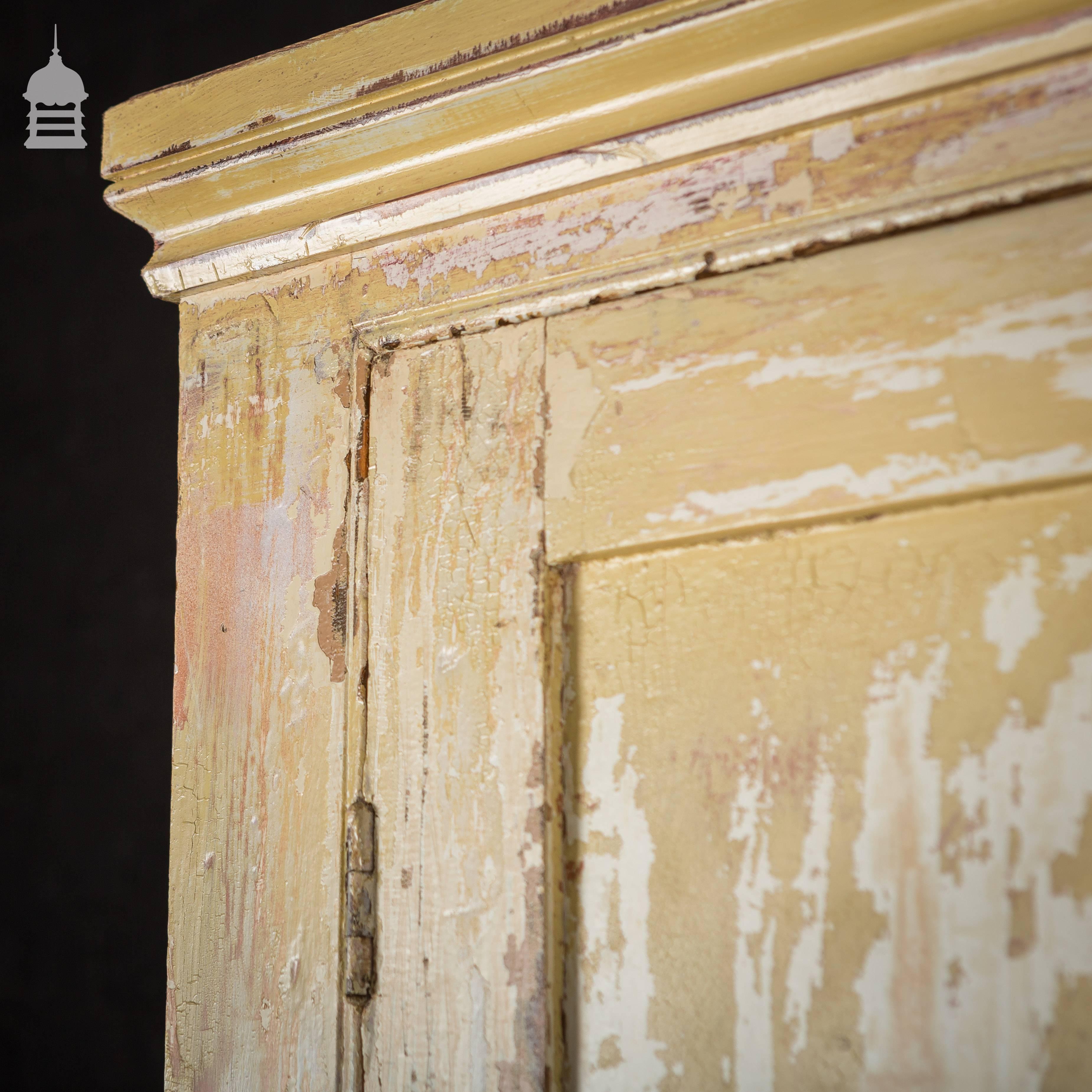 19th century pine pantry kitchen cupboards with distressed paint.