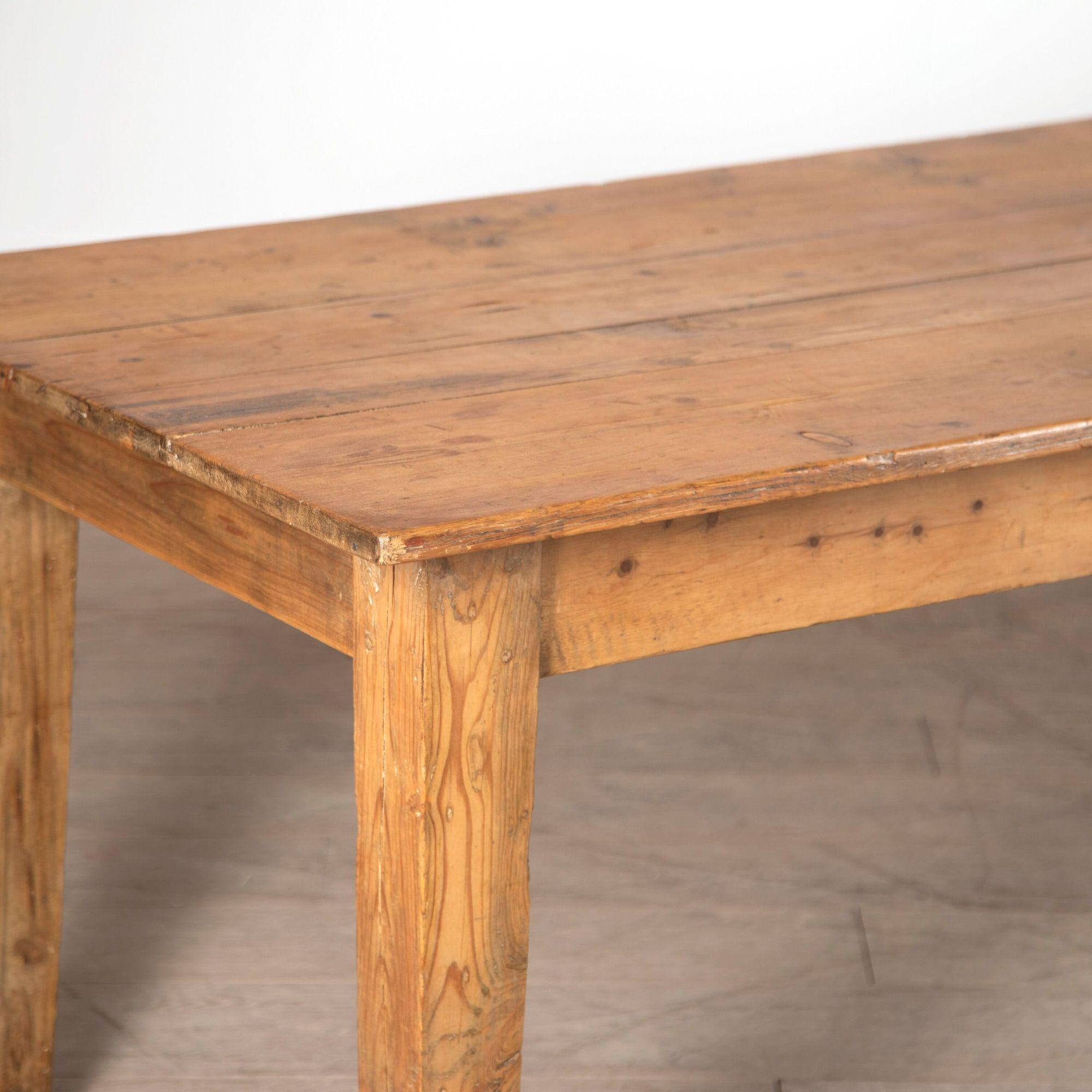 19th century English pine refectory table.
Dating from the Late 19th Century, this elegant pine dining table is of very attractive colour. 
Supported on square tapered legs.
With a simple, graceful design, this table would mix very easily with